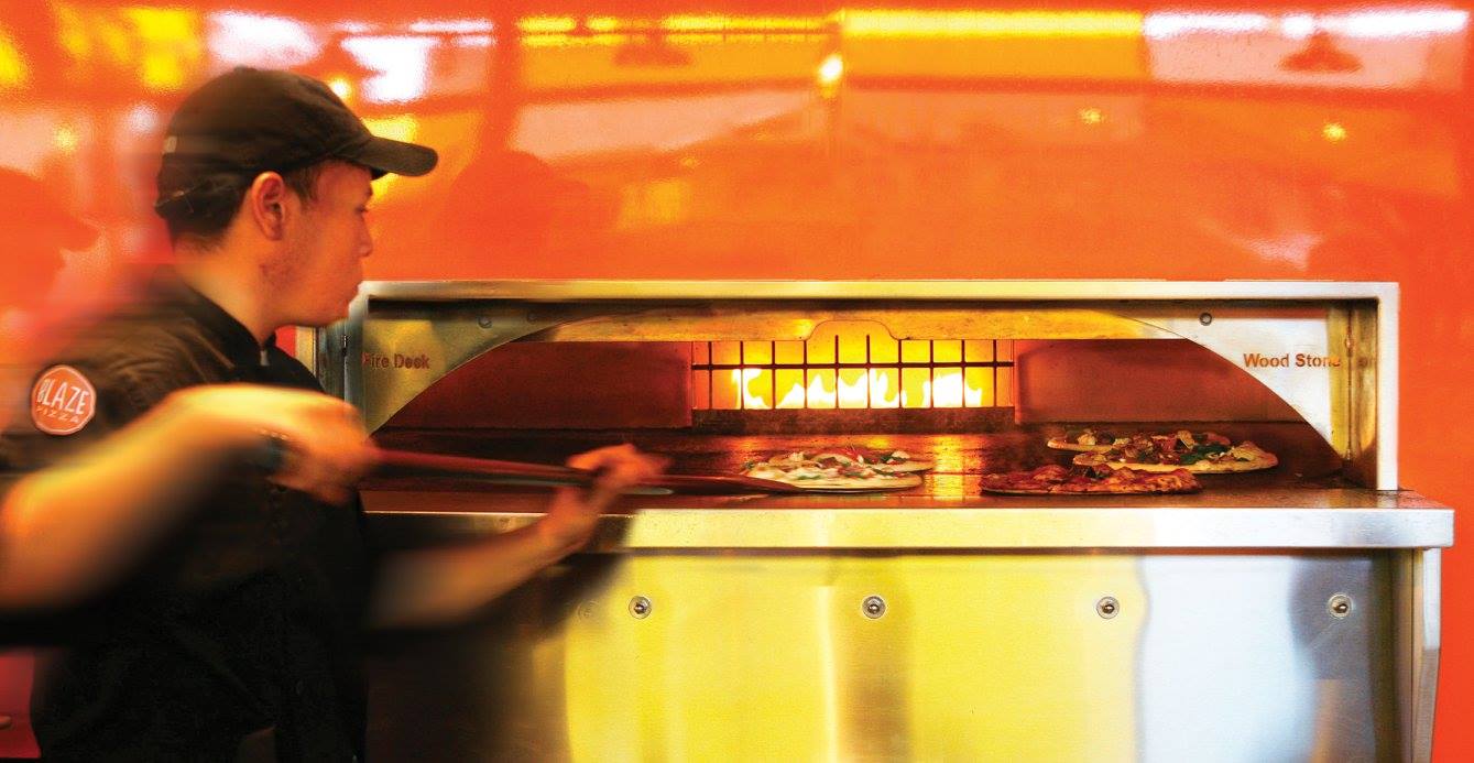A Blaze "pizzasmith" scooping up a "fire'd up" pie