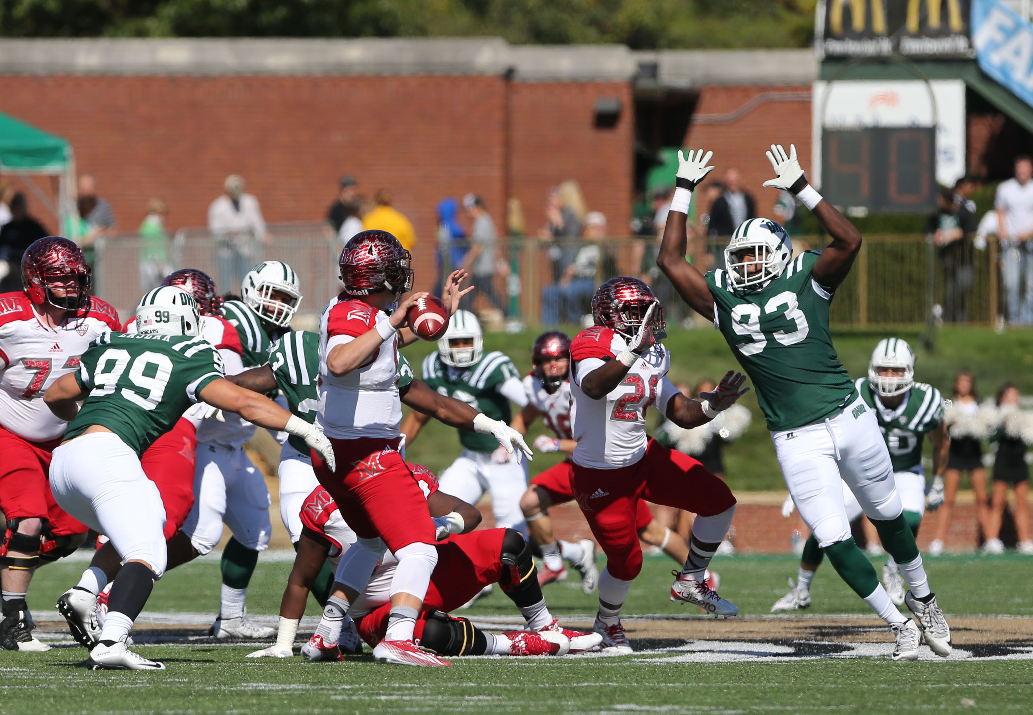Tarell Basham leaps to block a pass by Billy Bahl in last year's Battle of the Bricks.