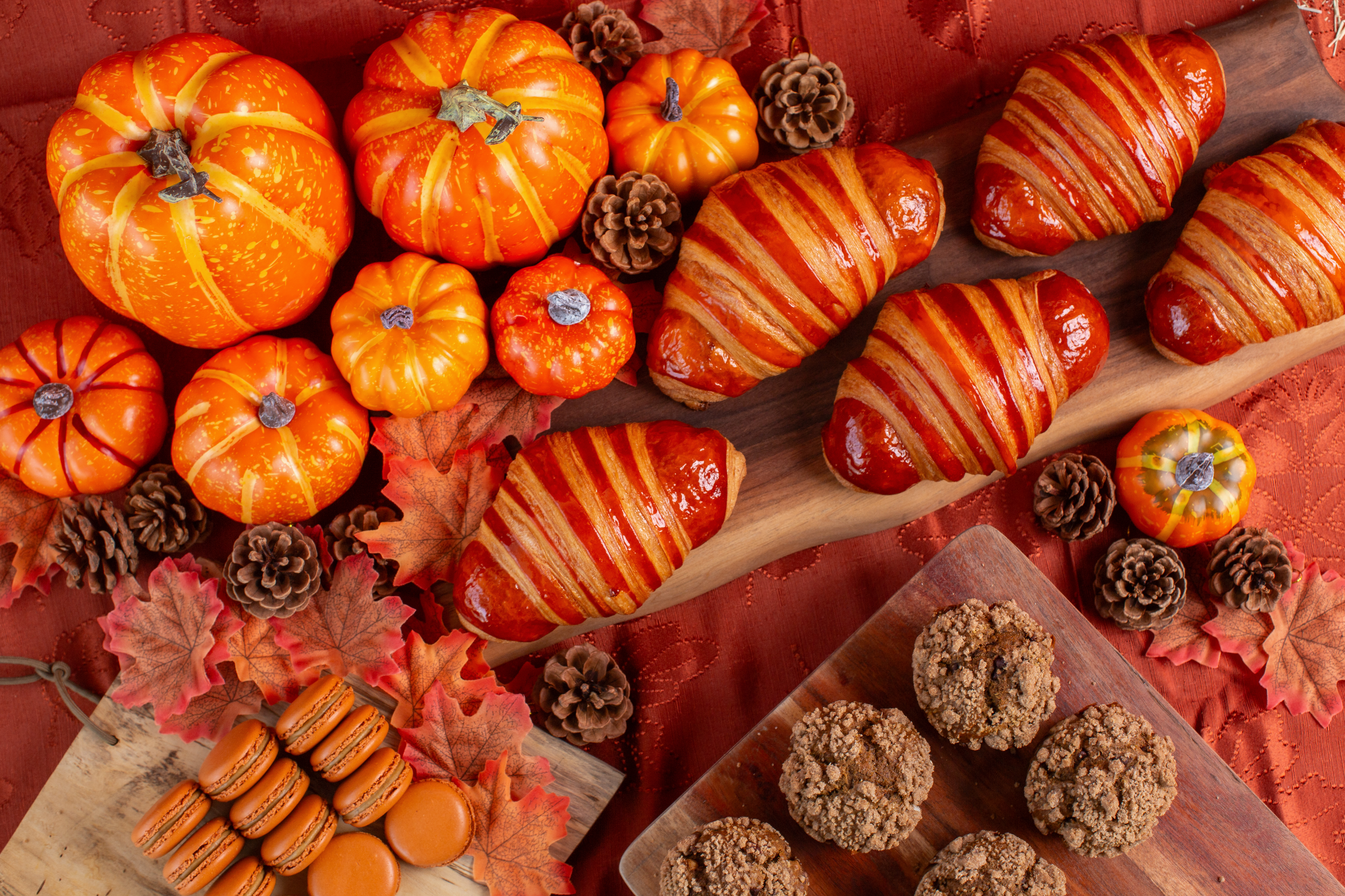 A spread of Common Bond’s pumpkin-themed treats, including pumpkin croissants, macarons, and muffins.