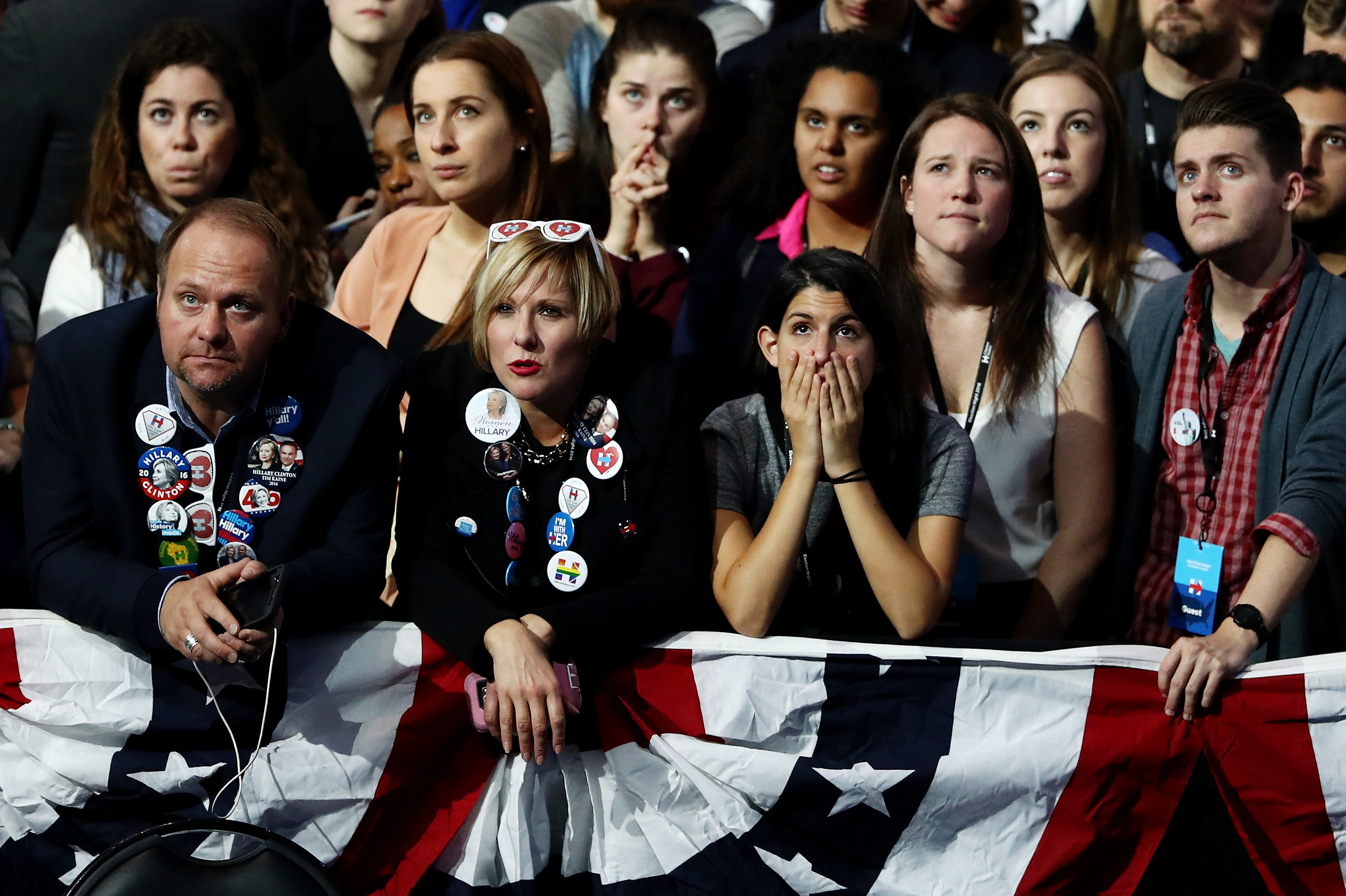 People watch voting results at Democratic presidential nominee former Secretary of State Hillary Clinton's election night event at the Jacob K. Javits Convention Center November 8, 2016 in New York City. 