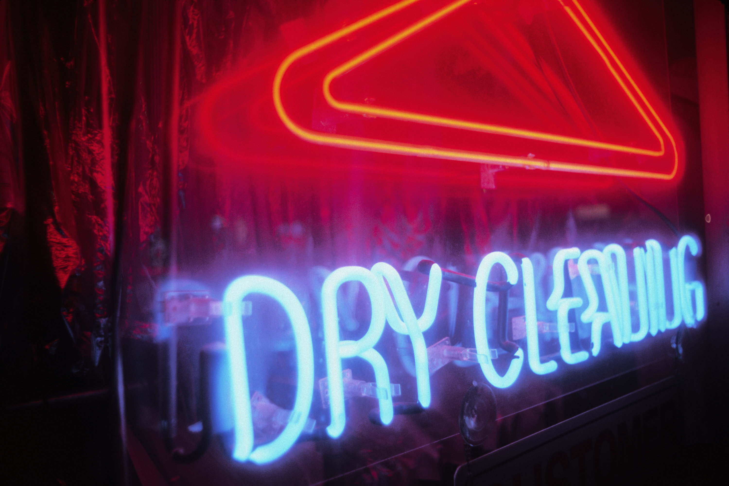 Neon dry cleaner sign with red hanger