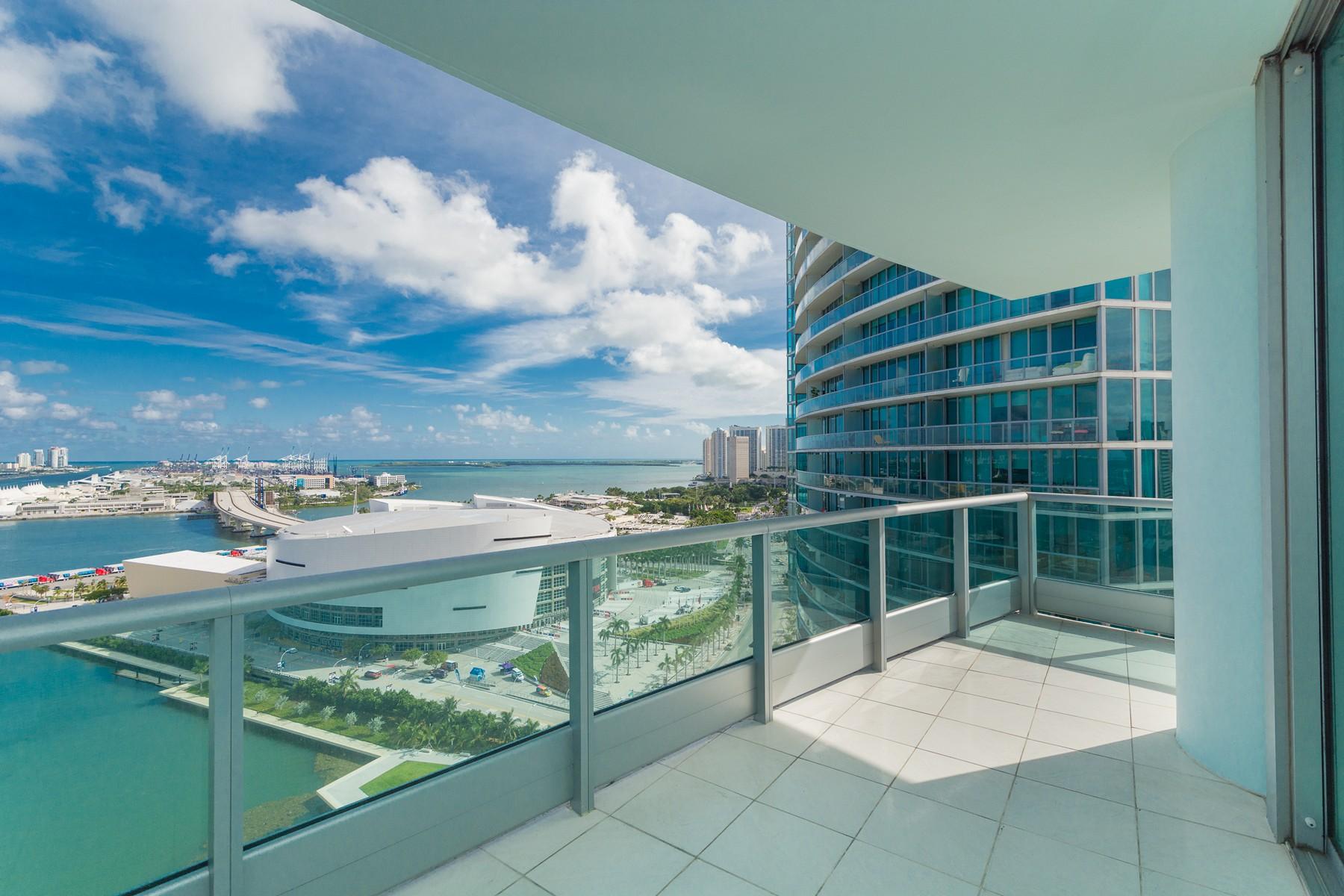 A downtown Miami condo balcony overseeing the bay and American Airlines Arena