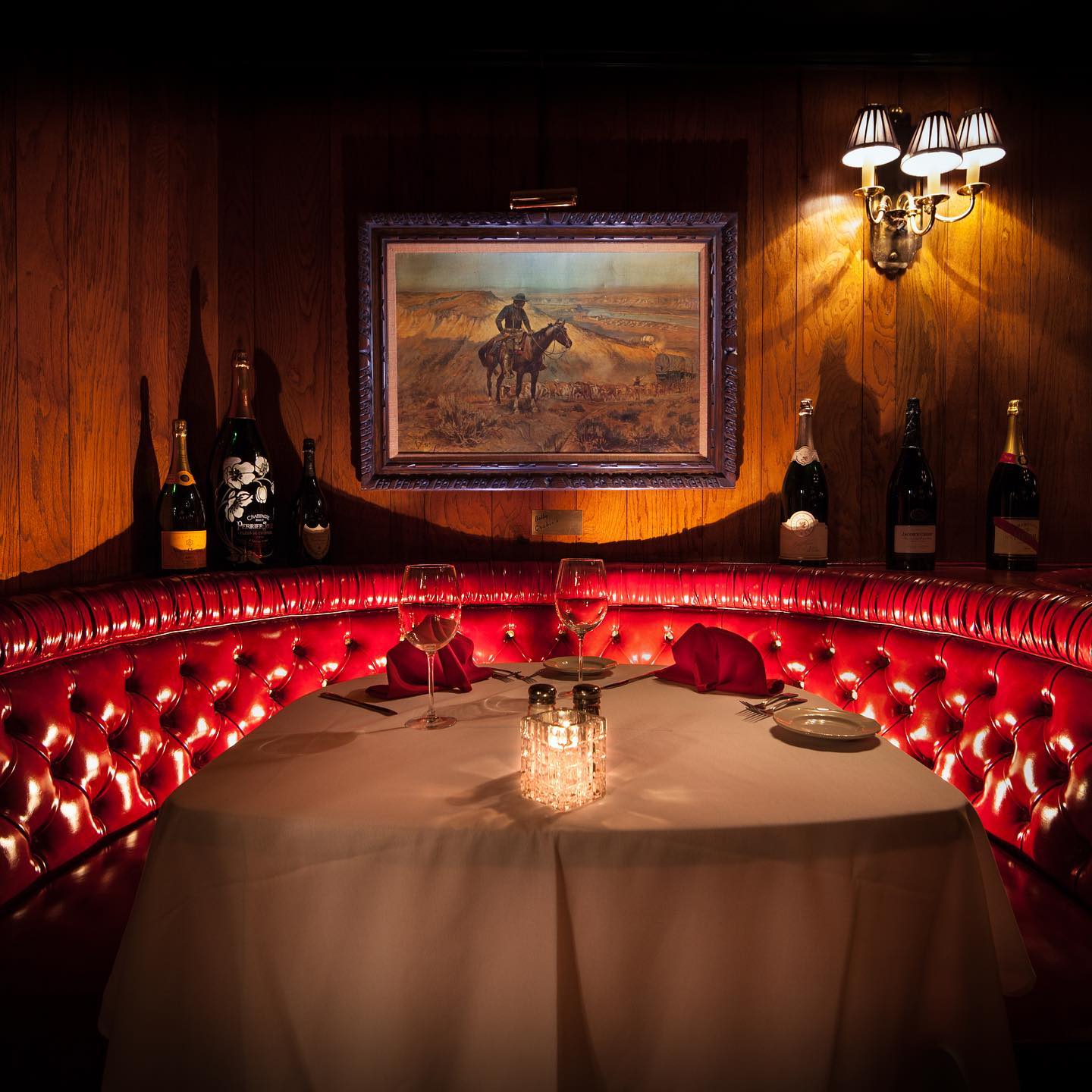 A red leather booth inside a steakhouse