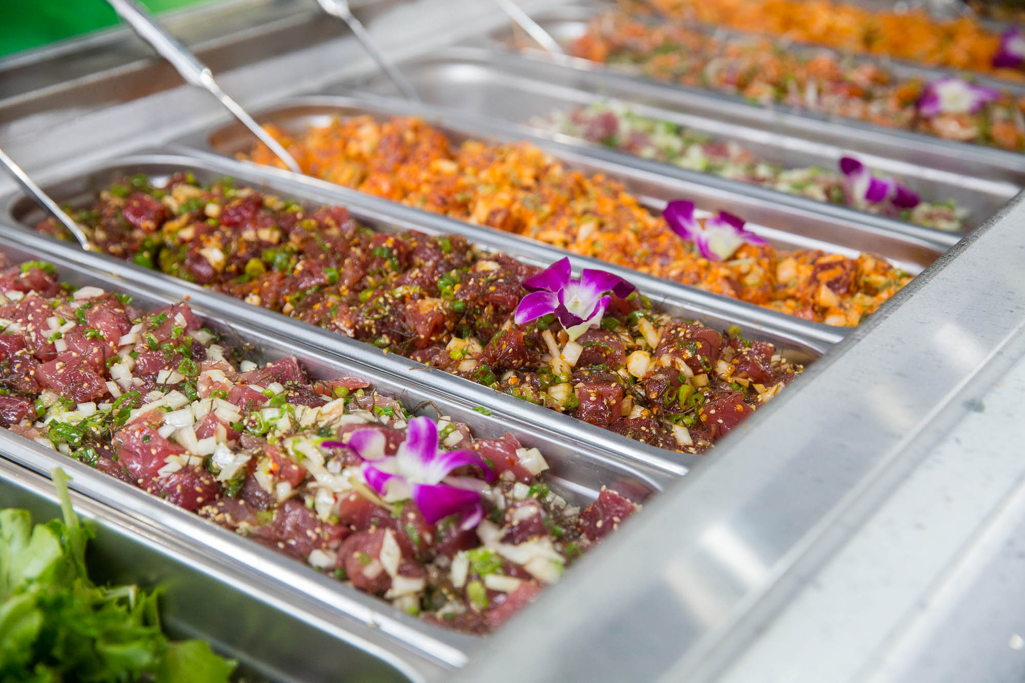 Many varieties of the Hawaiian raw fish salad, poke.