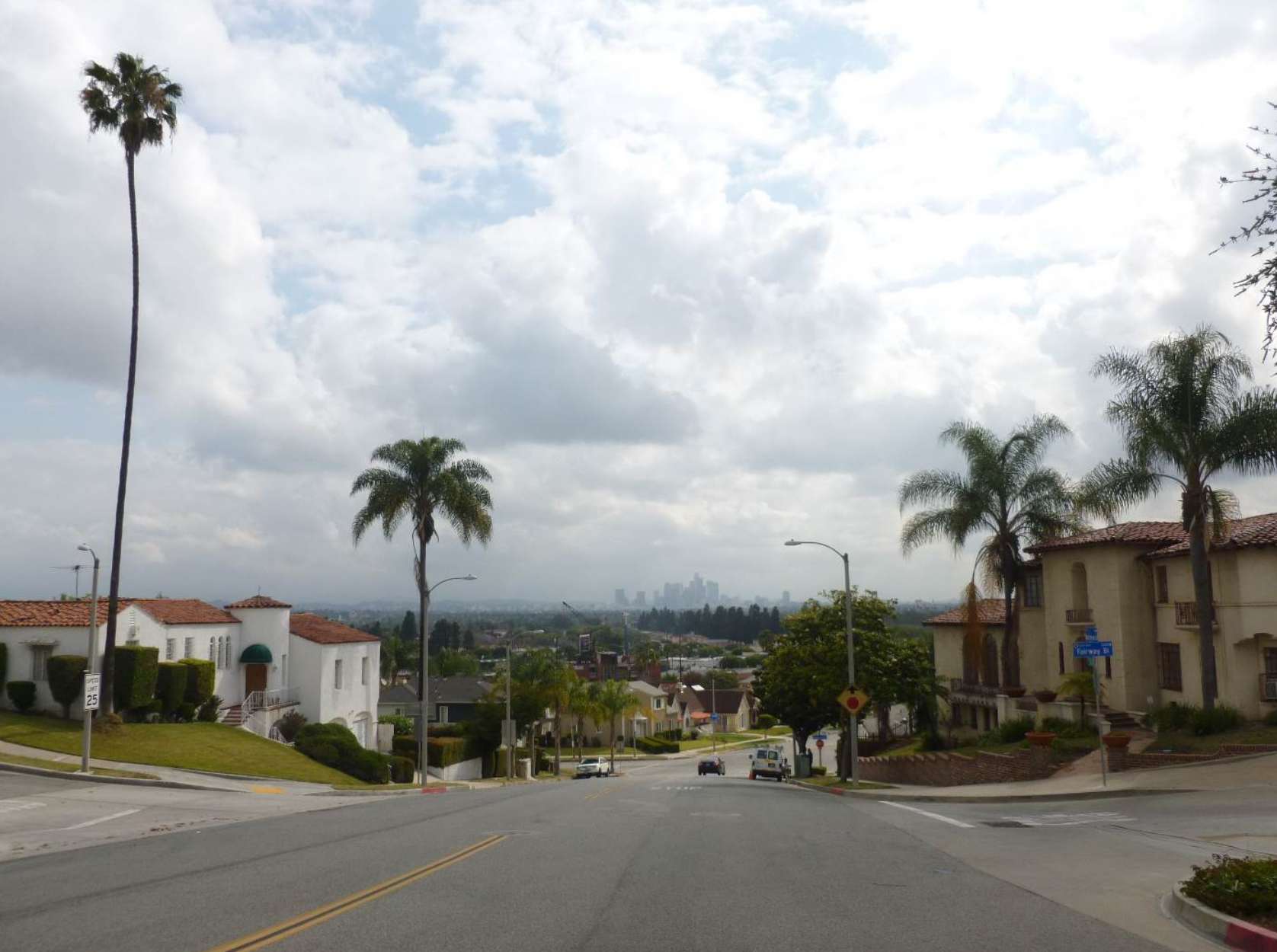 Mount Vernon Boulevard, streetscape and view of Downtown Los Angeles, facing east