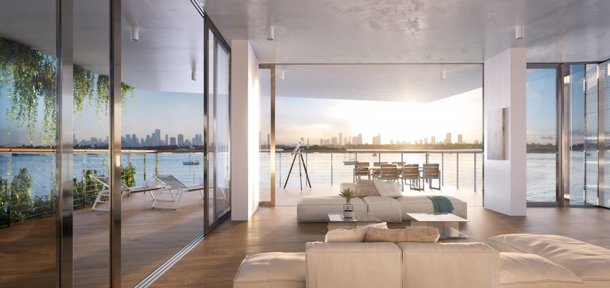 The Miami skyline beyond a gorgeous corner waterfront residence at Monad Terrace