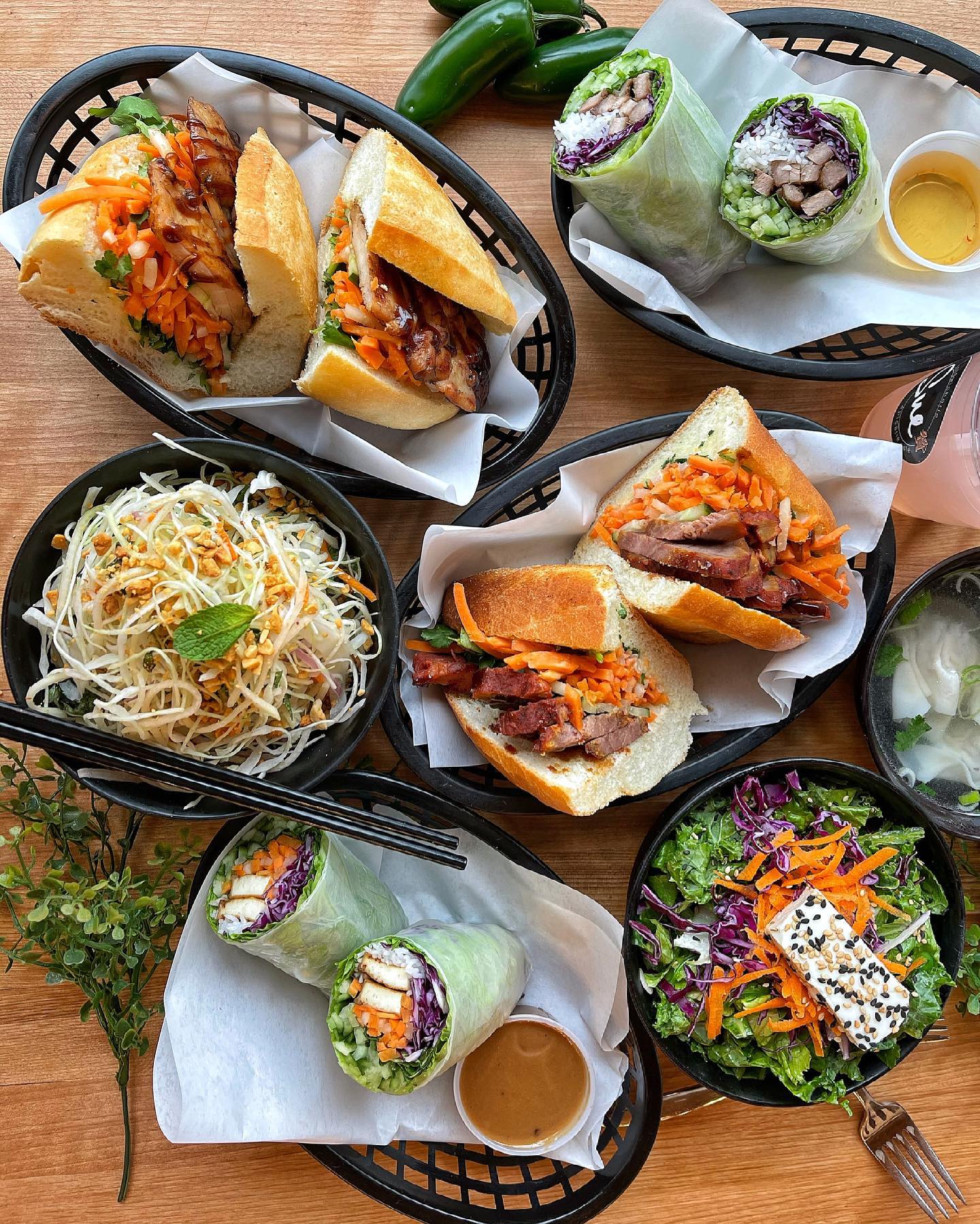 spread of Vietnamese sandwiches and salads