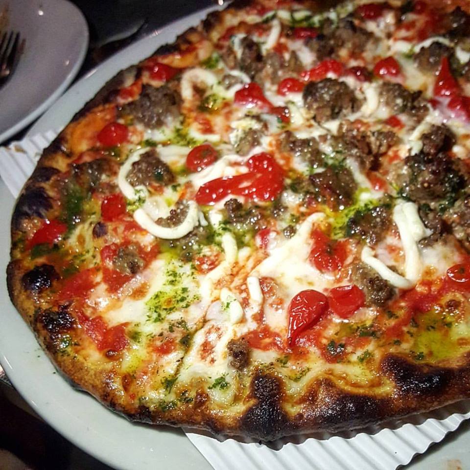 Stoked Pizza serves its pies with unconventional toppings, including meatballs and Peruvian tear drop peppers