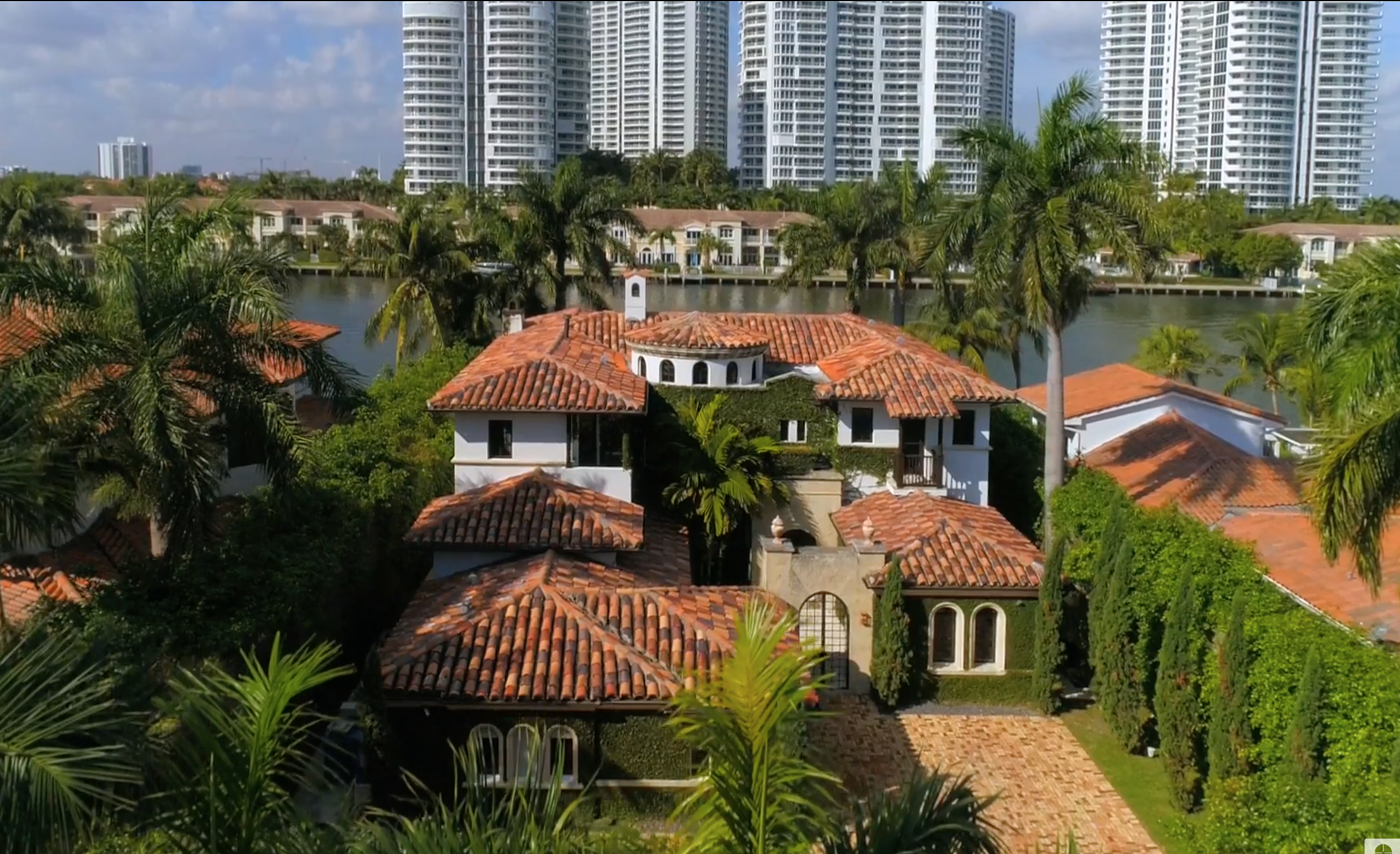A modern mediterranean mansion on the water in golden beach with the intracoastal behind it