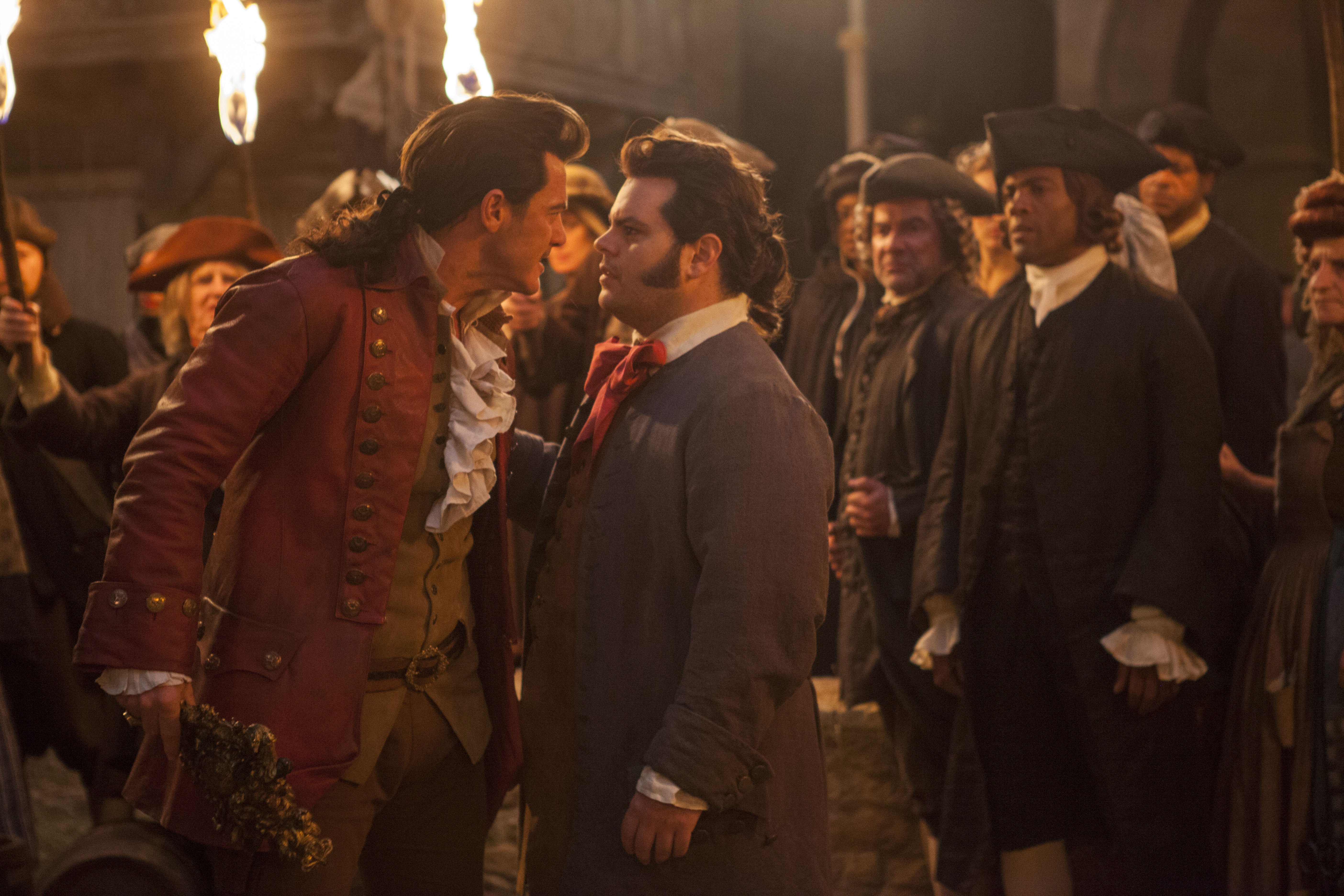 Gaston (Luke Evans) stares down LeFou (Josh Gad) in a screenshot from Beauty and the Beast