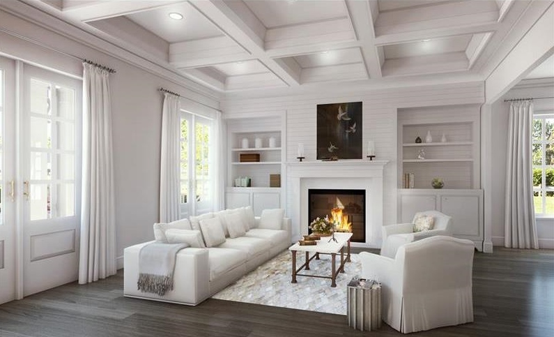 A white room with dark wood floors and deeply coffered ceilings.
