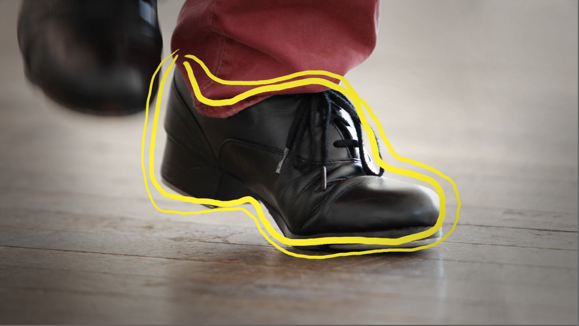 Tap dancing shoe with yellow outline