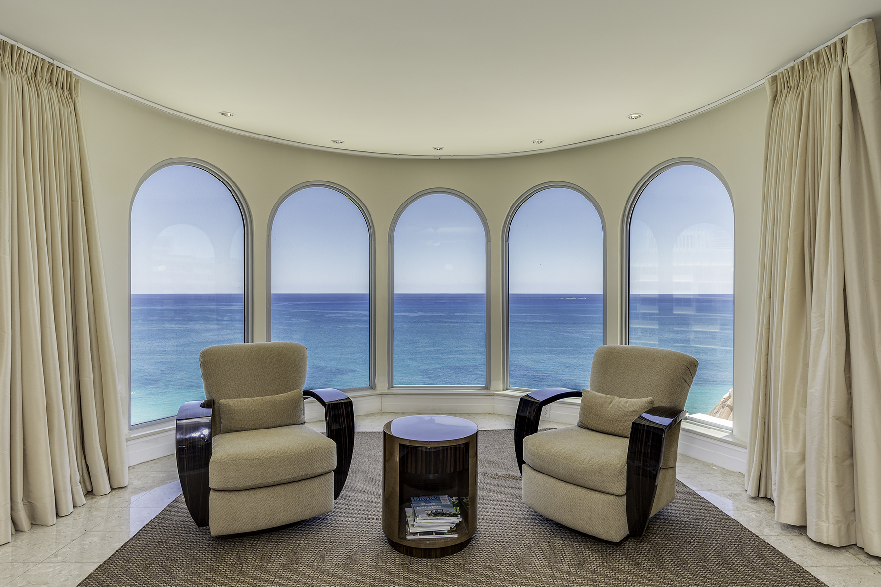 An oceanfront view in the master bedroom of a florida penthouse
