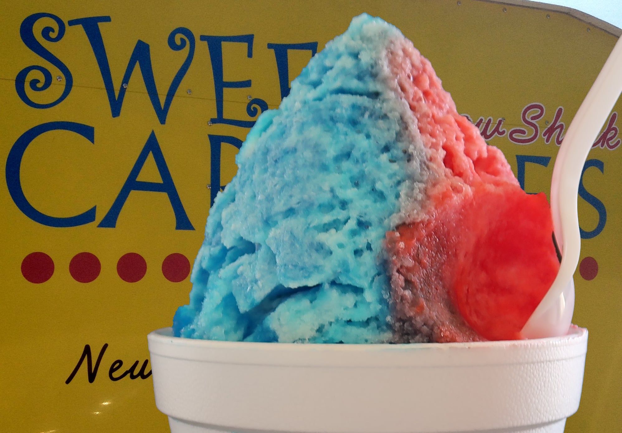 A snow cone in blue and red.
