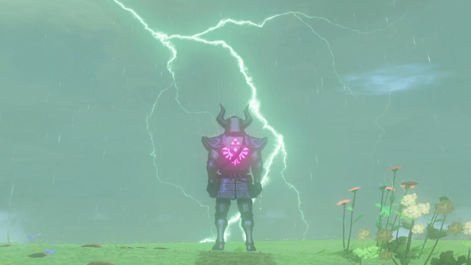 Link stands on a cliff wearing the Phantom Armor while looking at a lightning strike in Zelda: Tears of the Kingdom