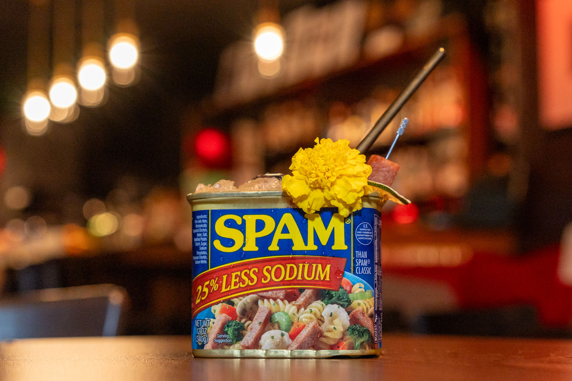 A cocktail served in a Spam container