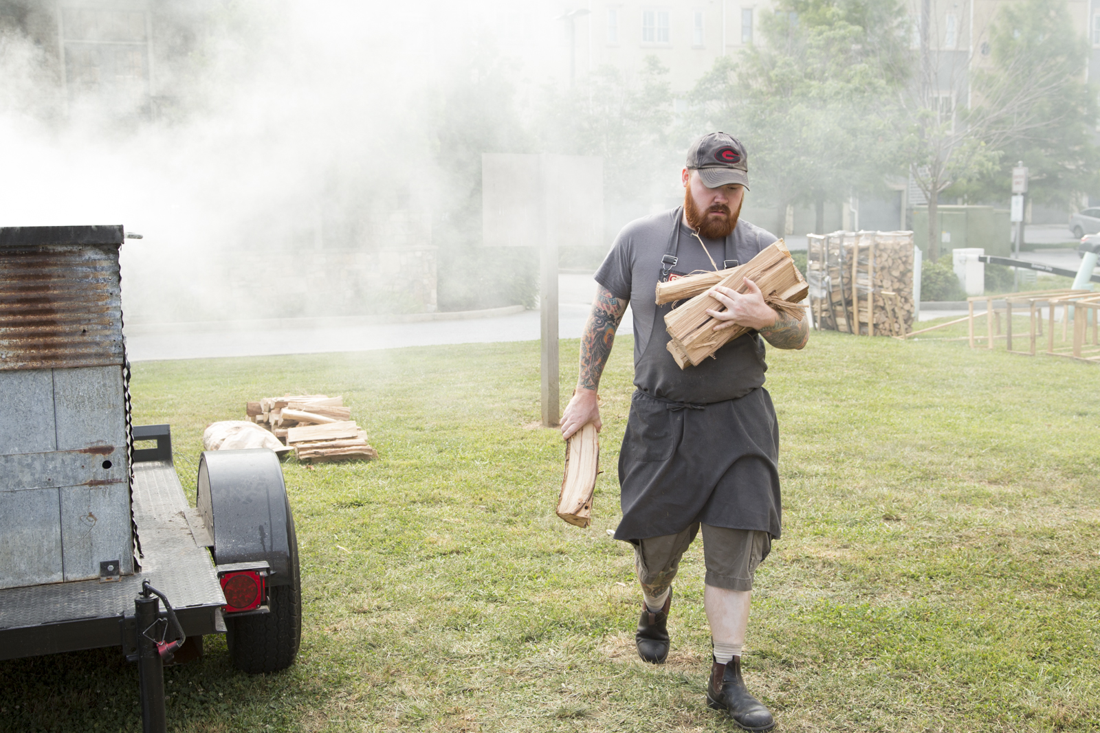 Kevin Gillespie carrying wood for a Terminus City smoker