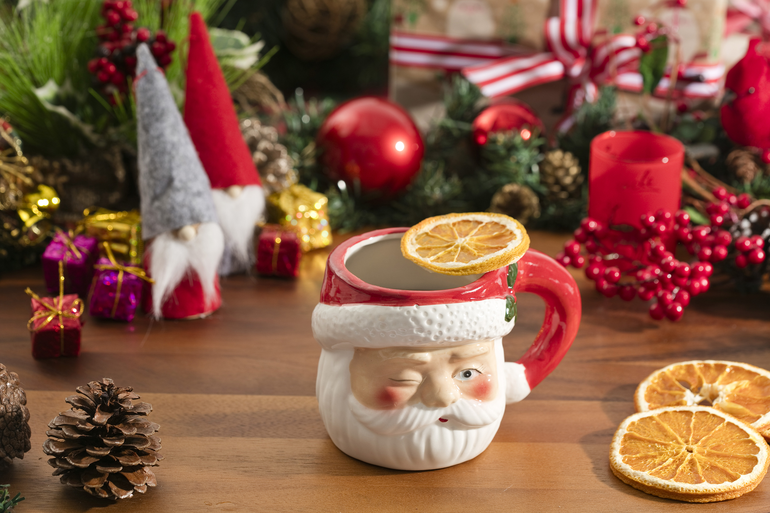 santa mug with holiday decor around it