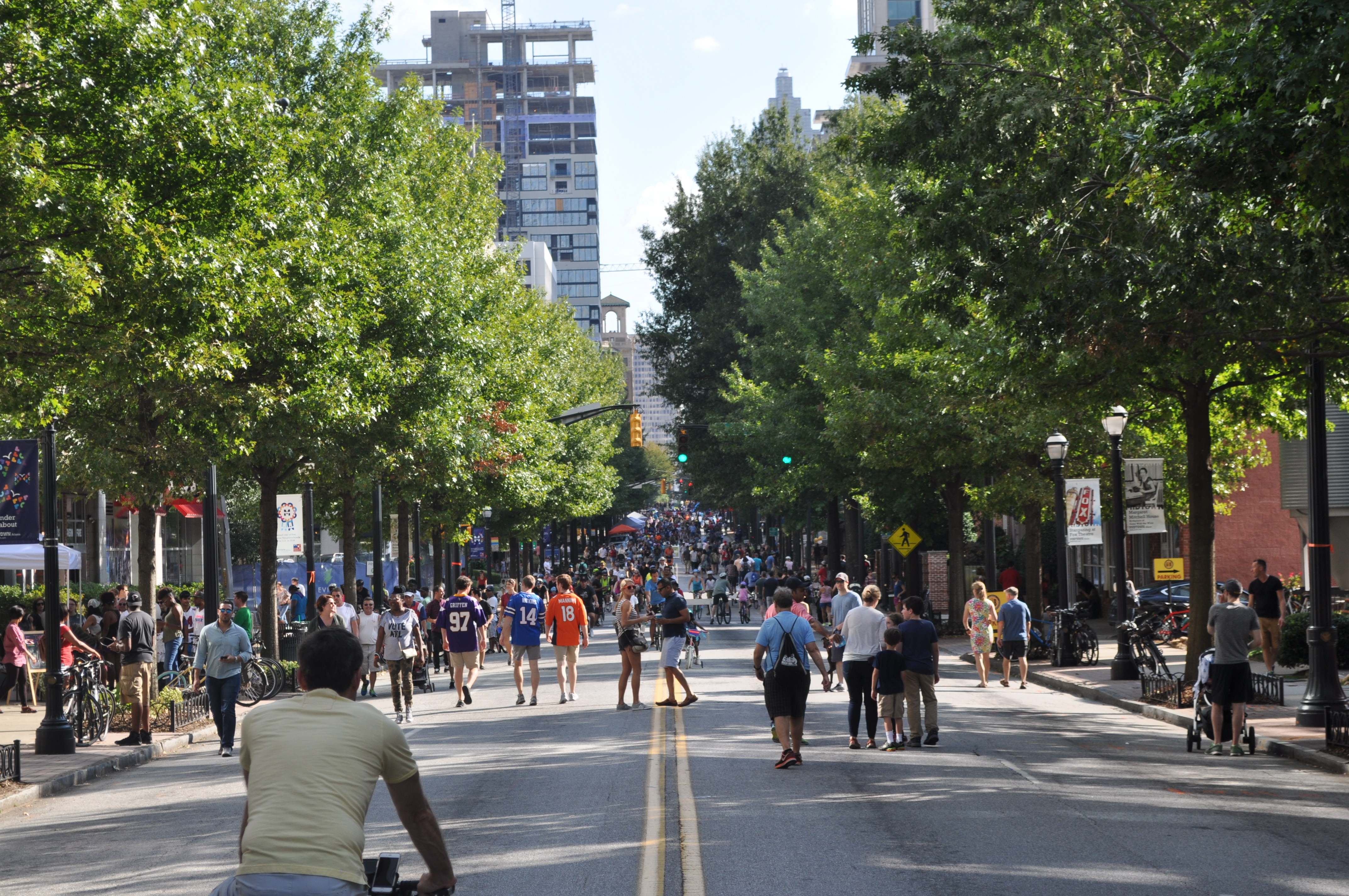 A view down Peachtree Street, with hundreds of cyclist and pedestrians packing the street.