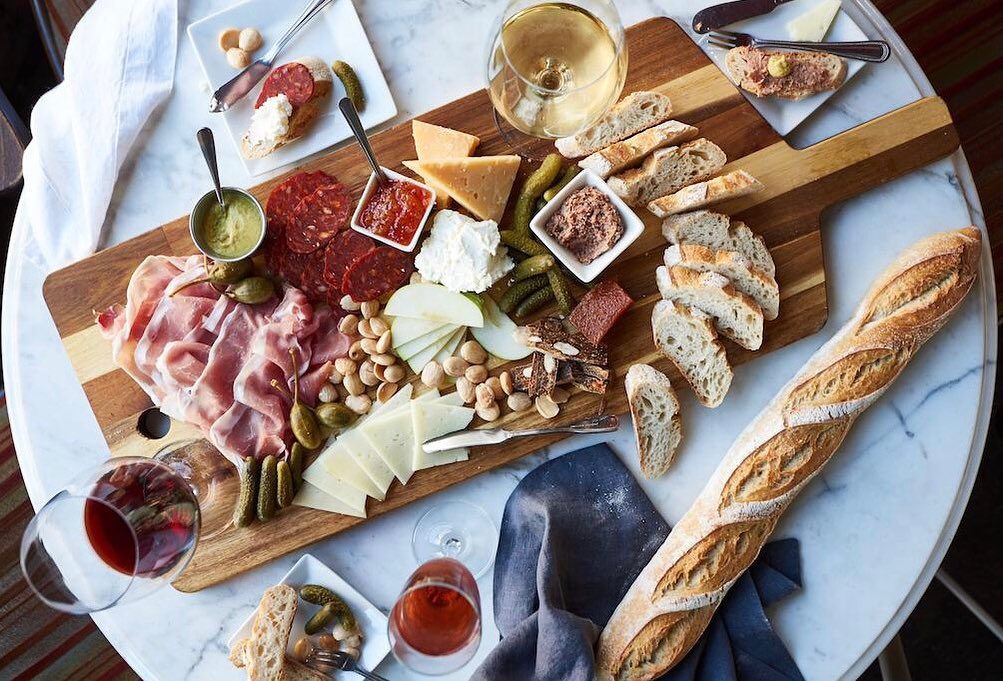a very large cheese board, viewed from overhead
