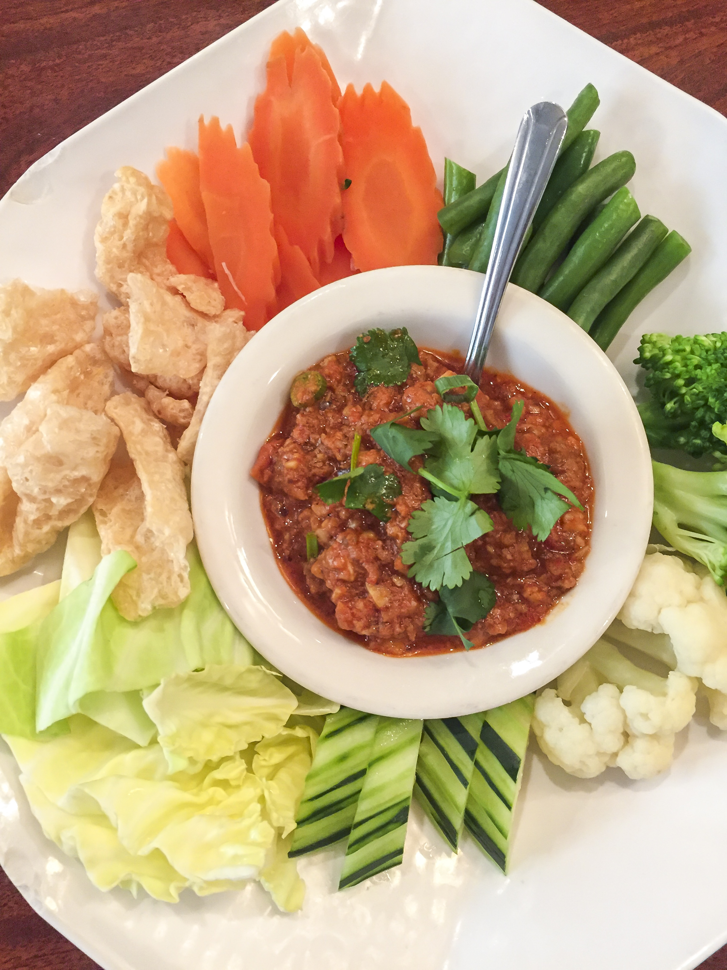 Nam Prik Ong — Northern Thai red chili dip composed of ground pork, tomato, and spices; served with assorted vegetables and fried pork rinds — at Lotus of Siam