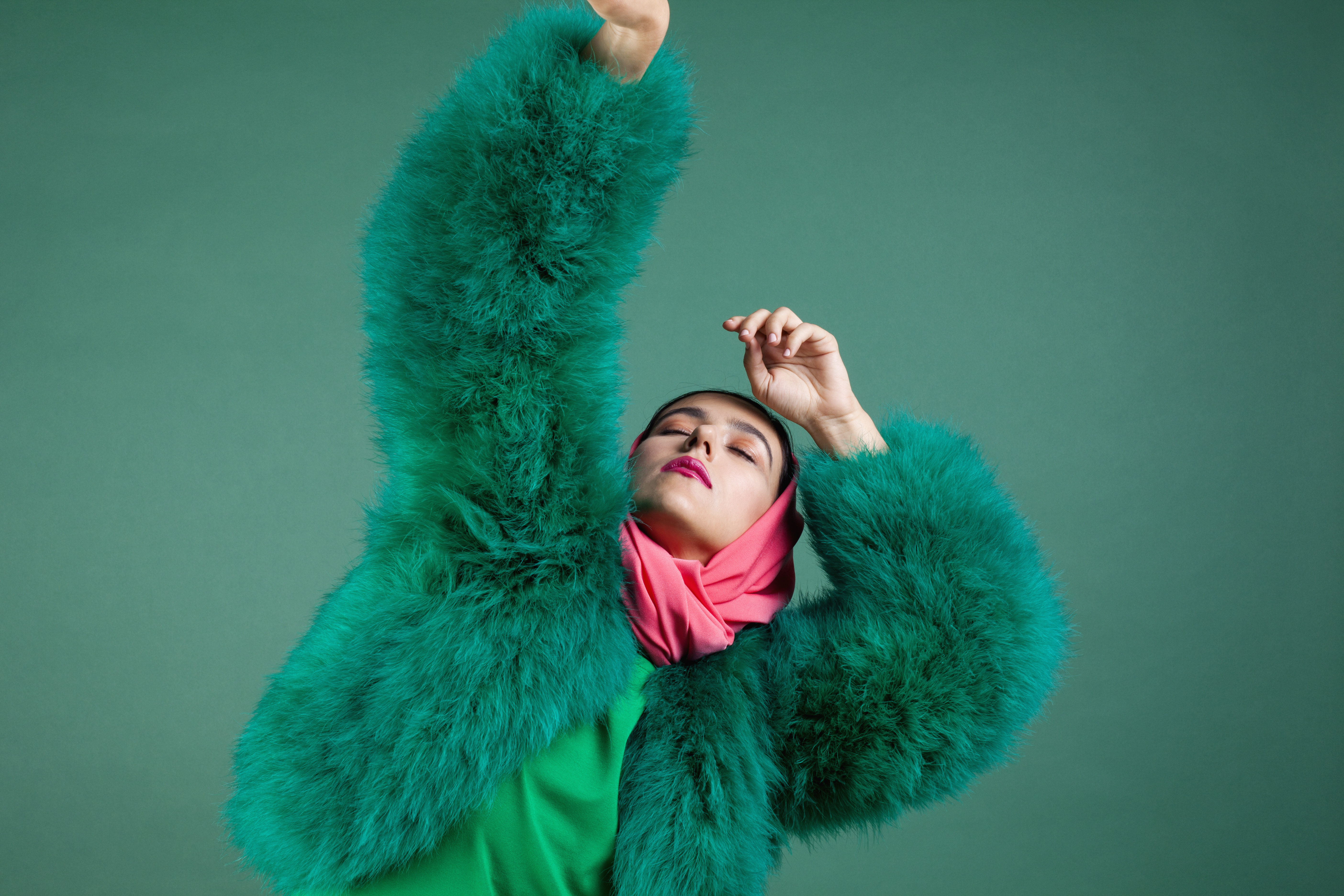 Woman in green fur coat