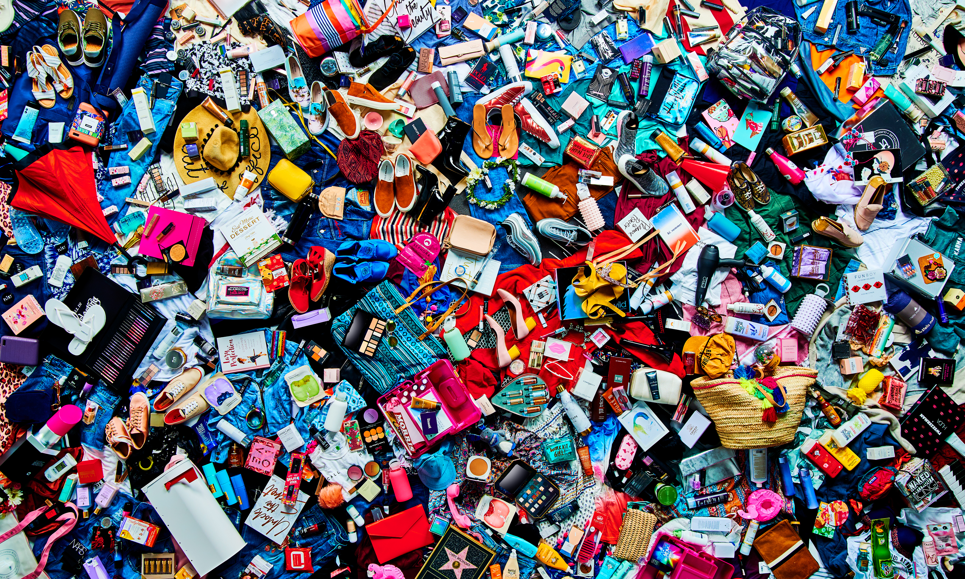 An overhead shot of hundreds of fashion and beauty products.