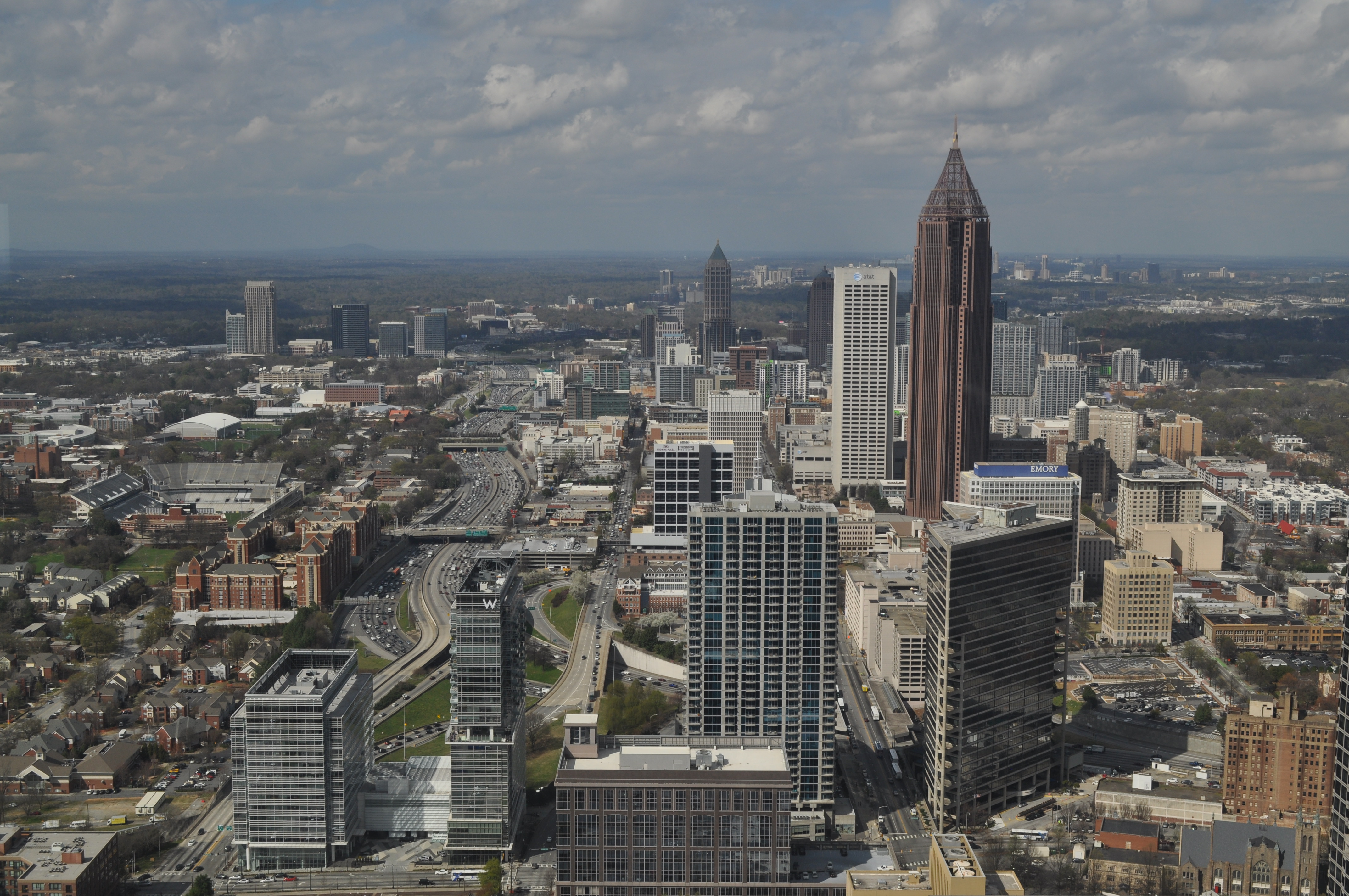 An aerial view of the city of Atlanta. There are various buildings and skyscrapers. 