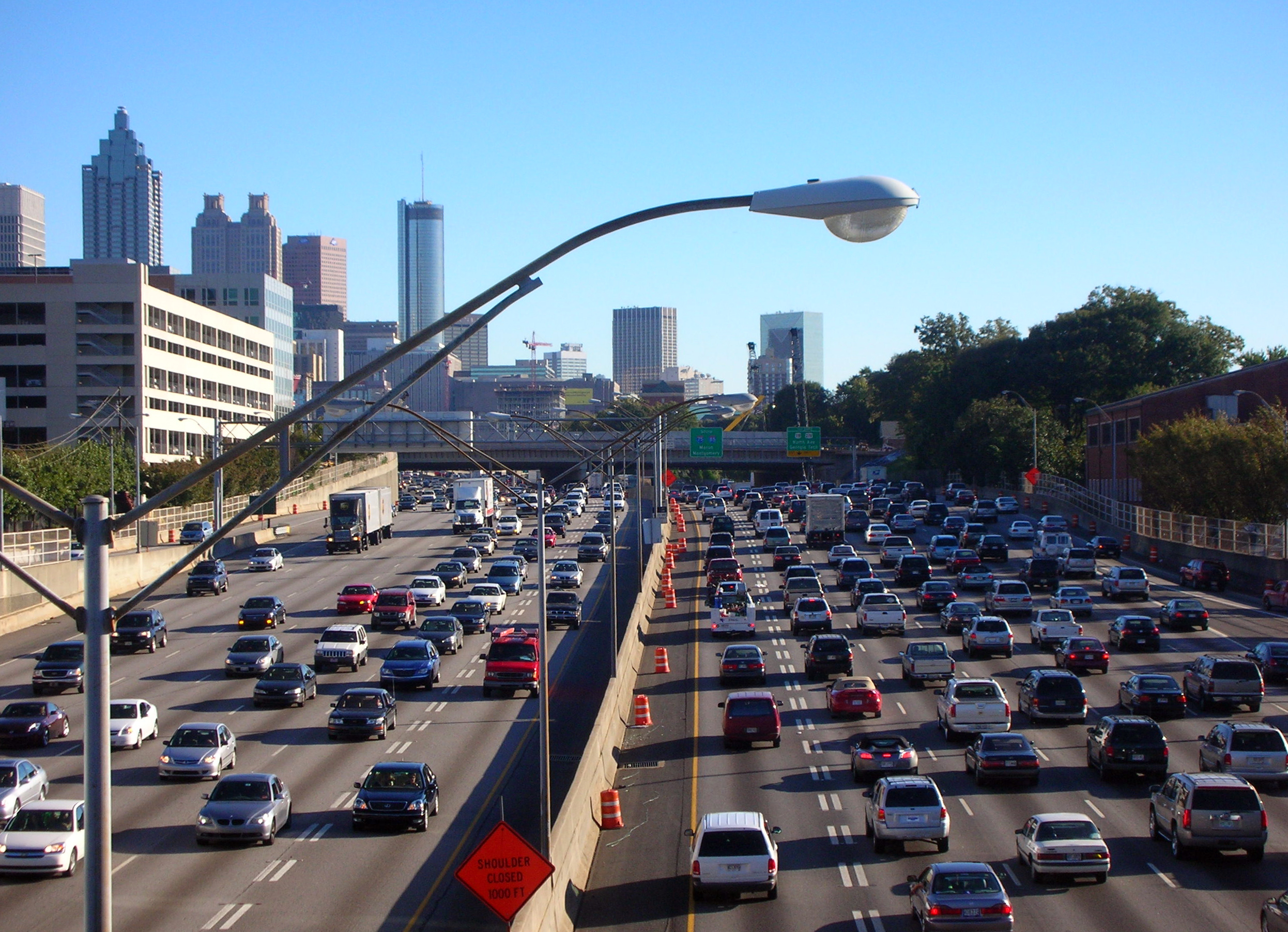 Cars sit in traffic heading both directions on the Downtown Connector.