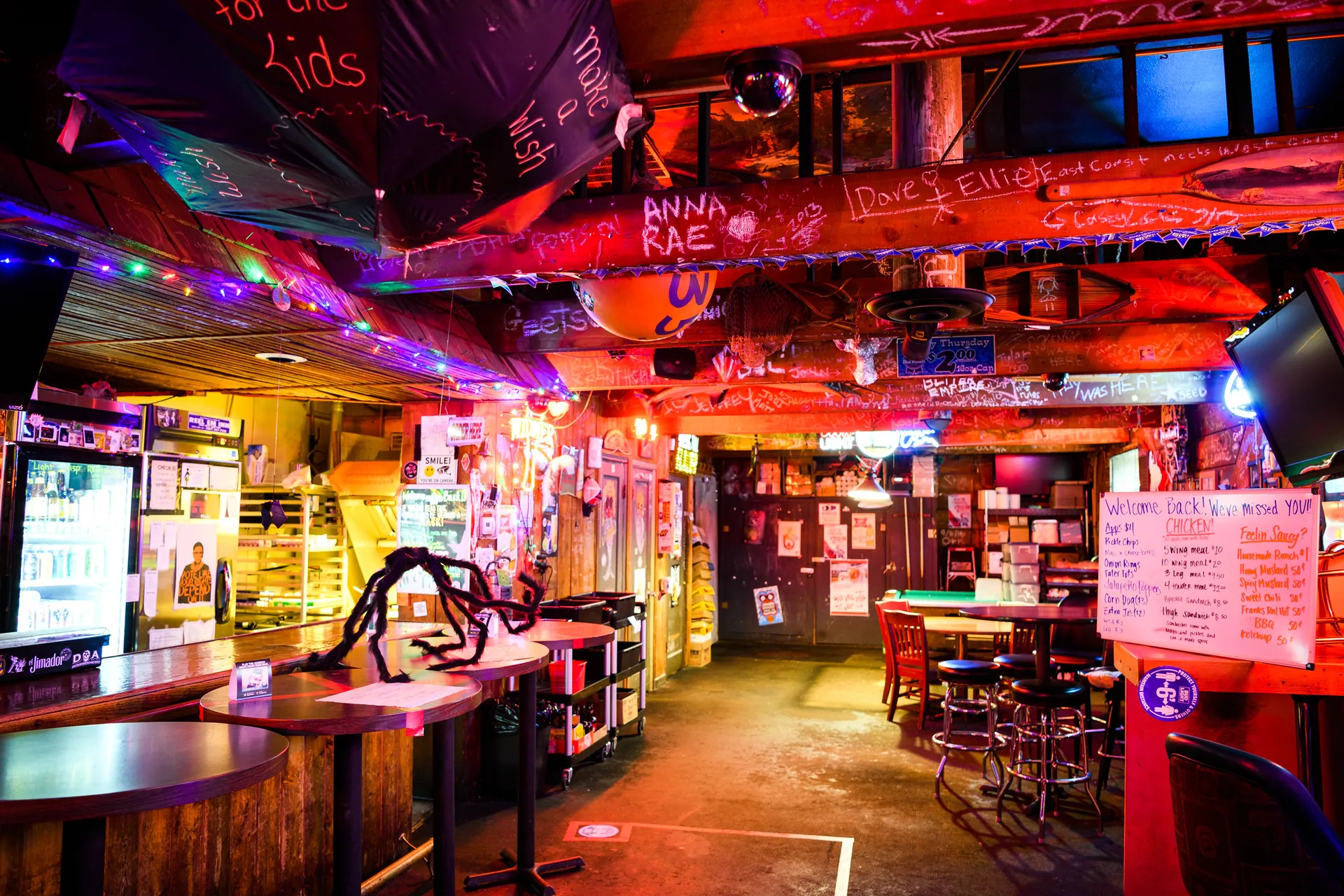 The interior of Reel M Inn, a cozy and dark dive bar.