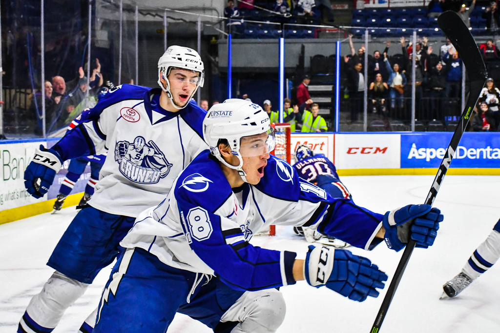 Syracuse Crunch Dennis Yan (18) celebrates his overtime goal against the Rochester Americans in American Hockey League (AHL) action at the War Memorial Arena in Syracuse, New York on Wednesday, November 22, 2017. Syracuse won 6-5 in Overtime.