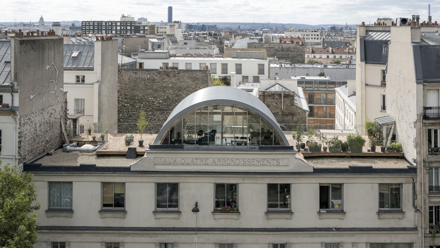 Prefab barrel-vaulted roof extension in Paris