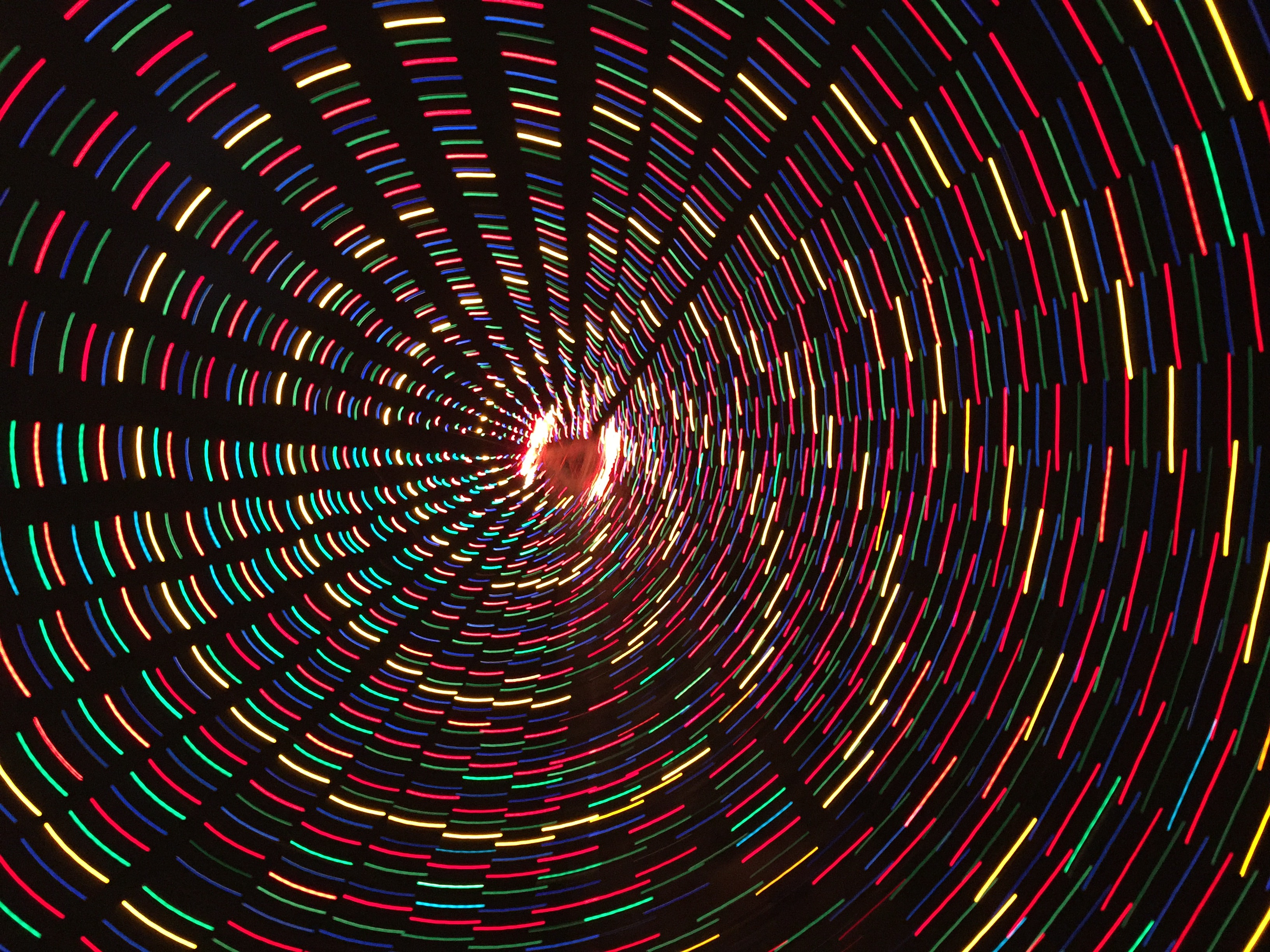 An abstract photo of blurred lights in a spiral.