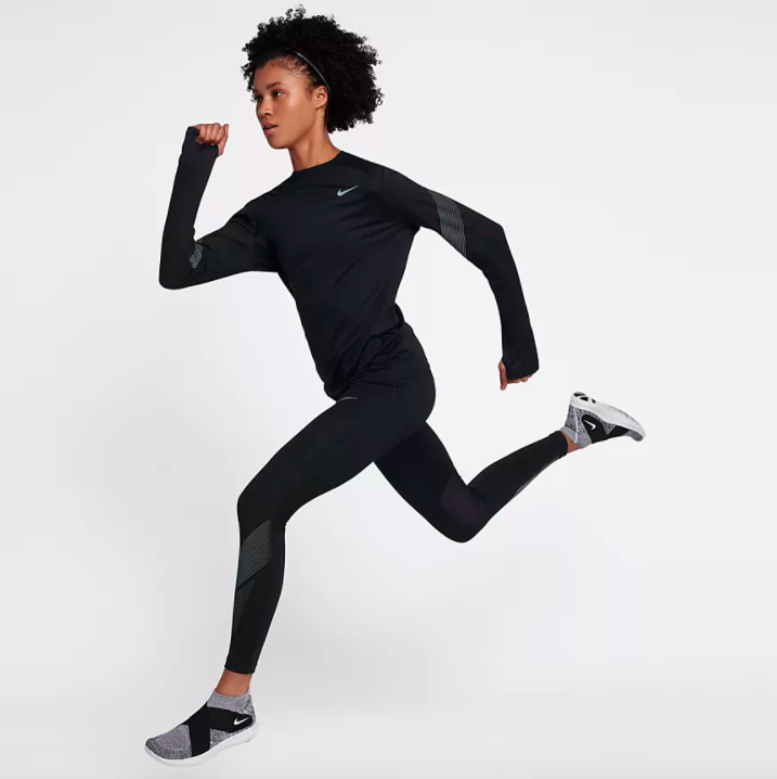 Model running in Nike Dri-Fit Miller Flash Top