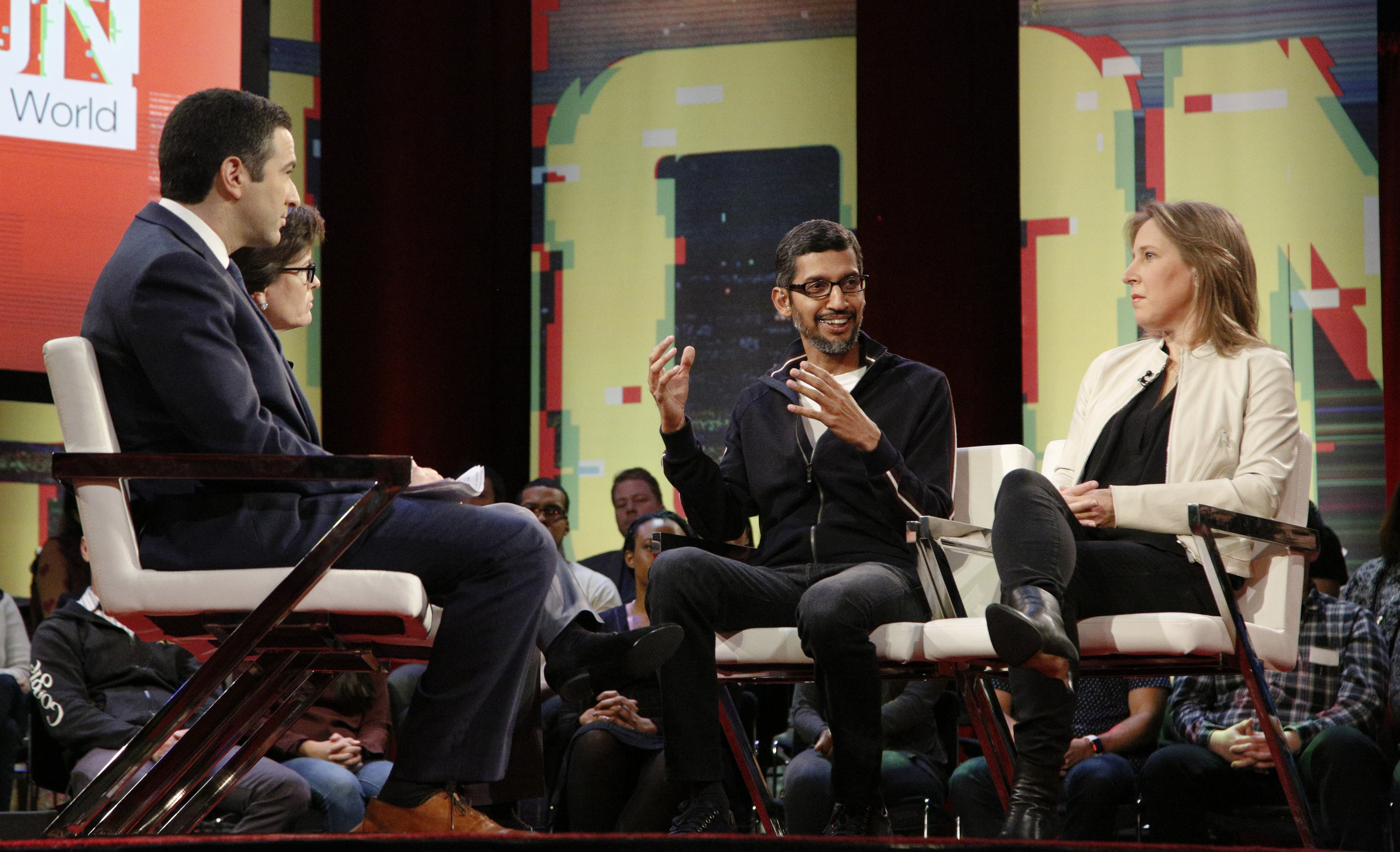 Google CEO Sundar Pichai and YouTube CEO Susan Wojcicki onstage with Recode’s Kara Swisher and MSNBC host Ari Melber.