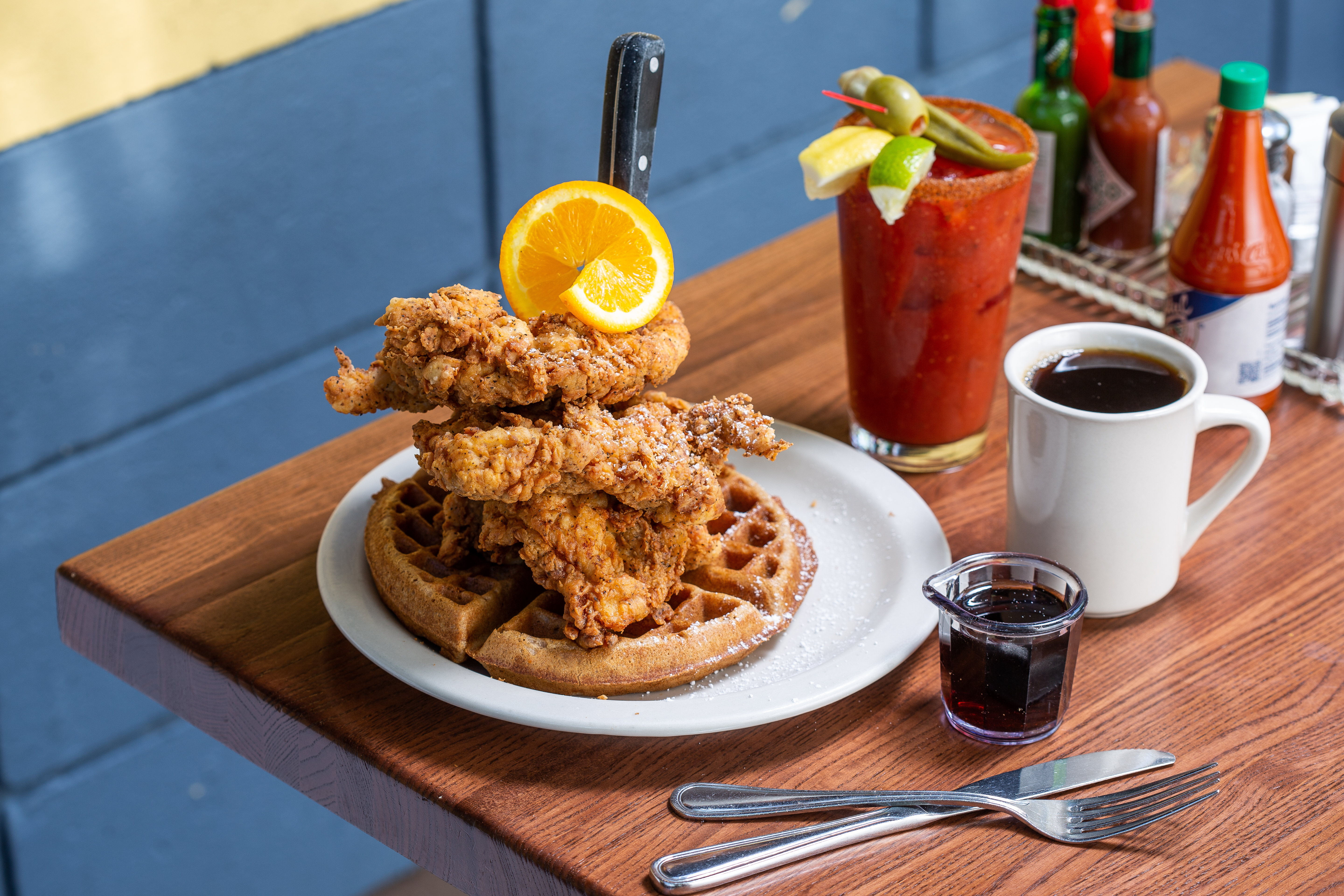 Fried chicken on a sweet potato waffle with a bloody mary at Screen Door in Portland.