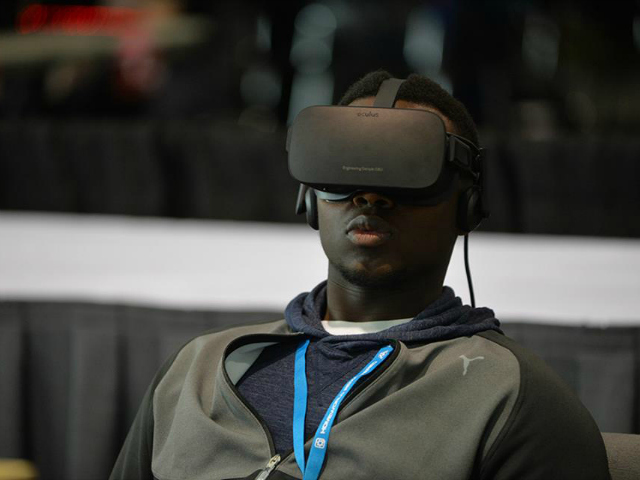 A man in an Oculus VR headset