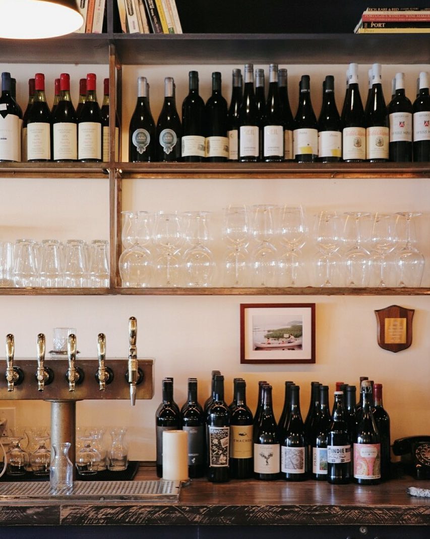 Bottles on a shelf at Mirabelle wine bar