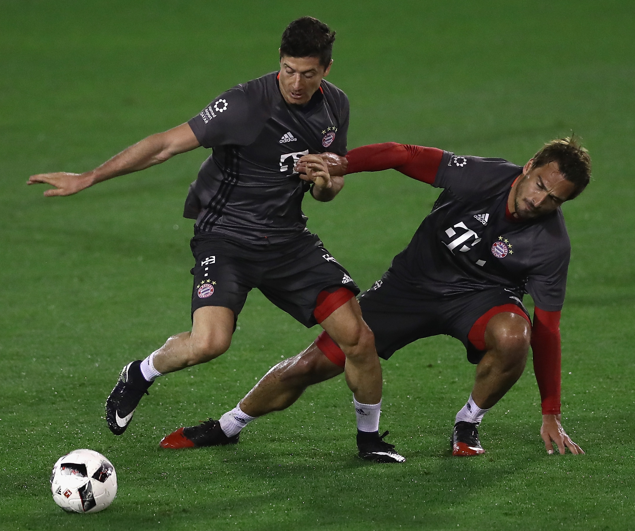 Robert Lewandowski is challenged by Mats Hummels during a training session at day 5 of the Bayern Muenchen training camp at Aspire Academy on January 7, 2017 in Doha, Qatar.