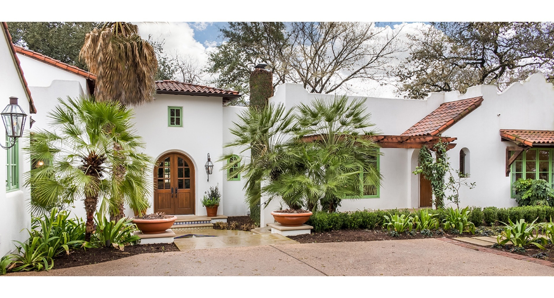 White stucco Spanish Colonial with red tile roof