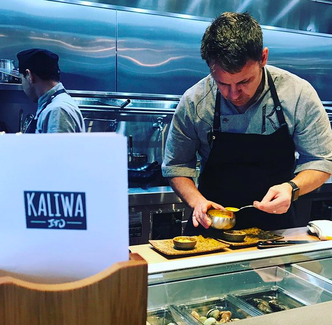 Kaliwa co-founder Cathal Armstrong preparing a dish at his new D.C. restaurant. 