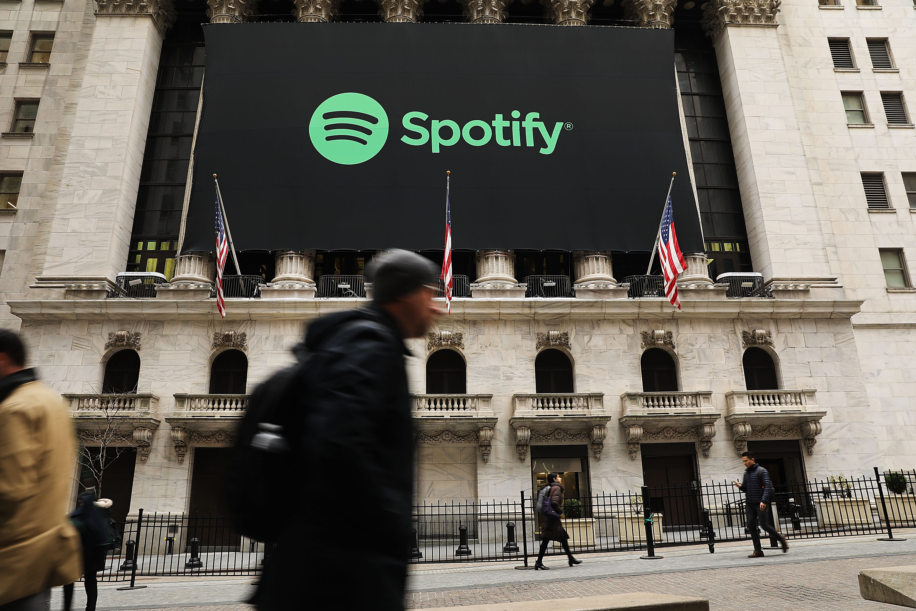 The New York Stock Exchange building with a Spotify banner out front