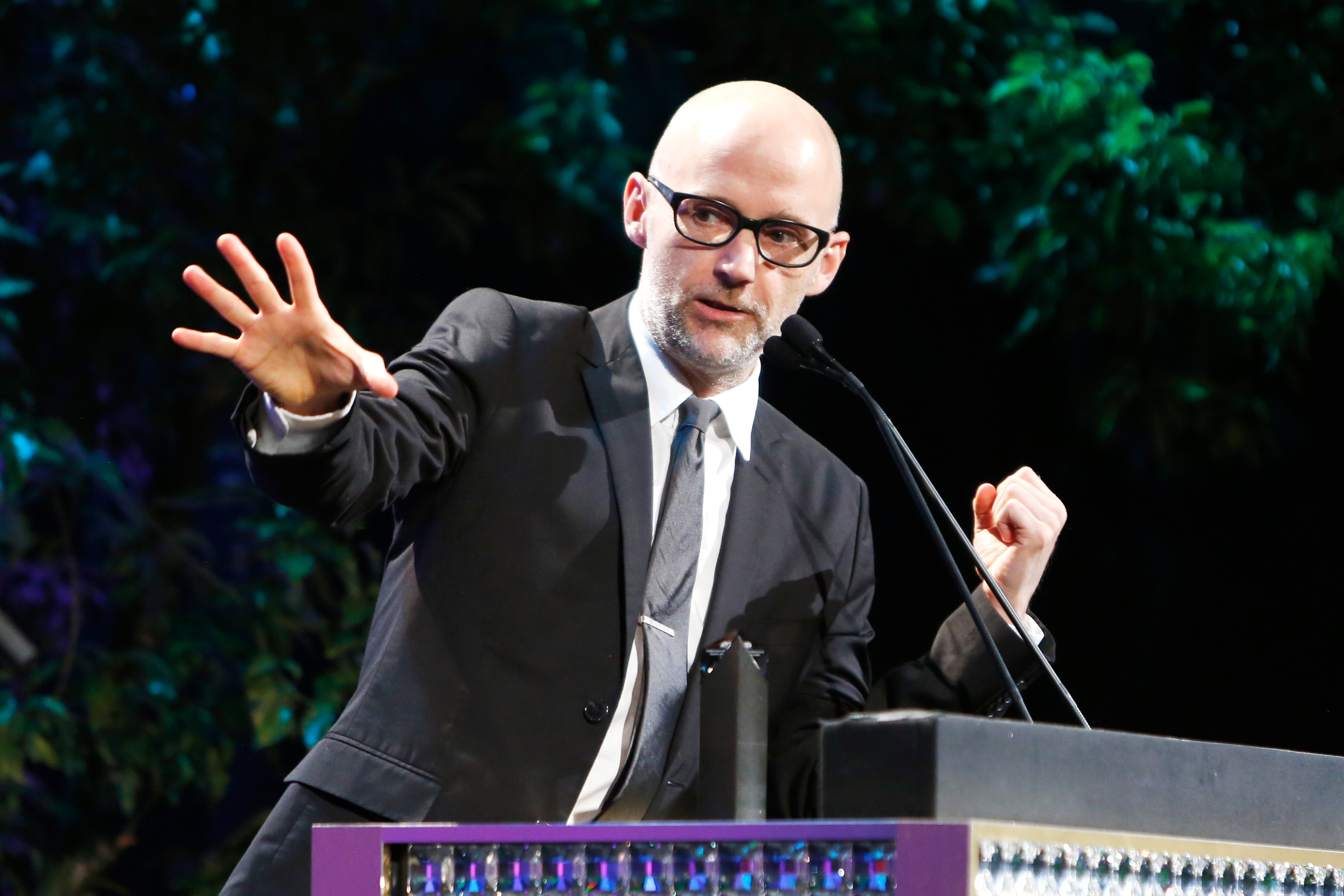 Moby speaking from a podium