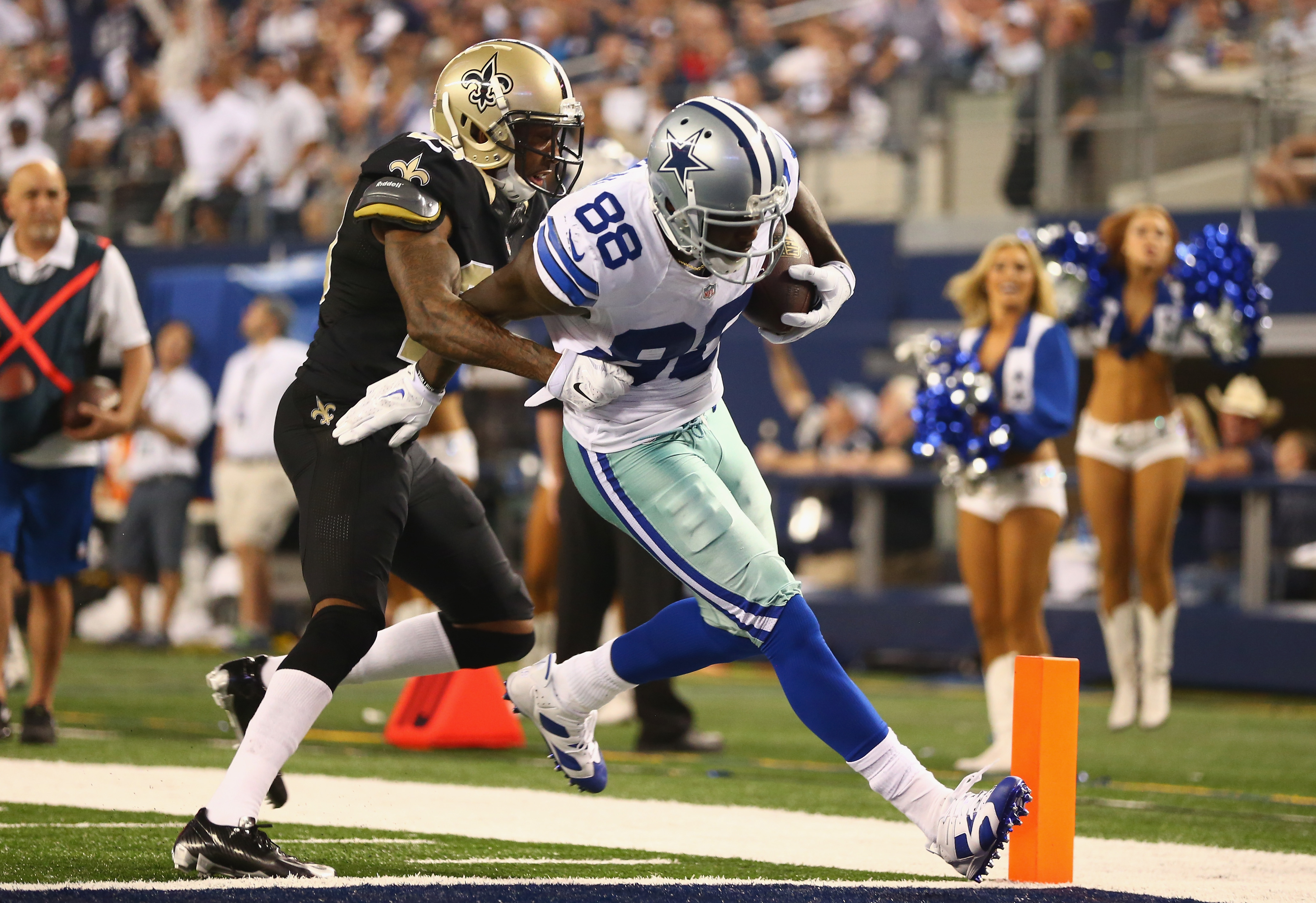 ARLINGTON, TX - New Orleans Saints cornerback Keenan Lewis (28) escorts Dallas Cowboys wide receiver Dez Bryant (88) into the end zone during a 2014 game at AT&amp;T Stadium.