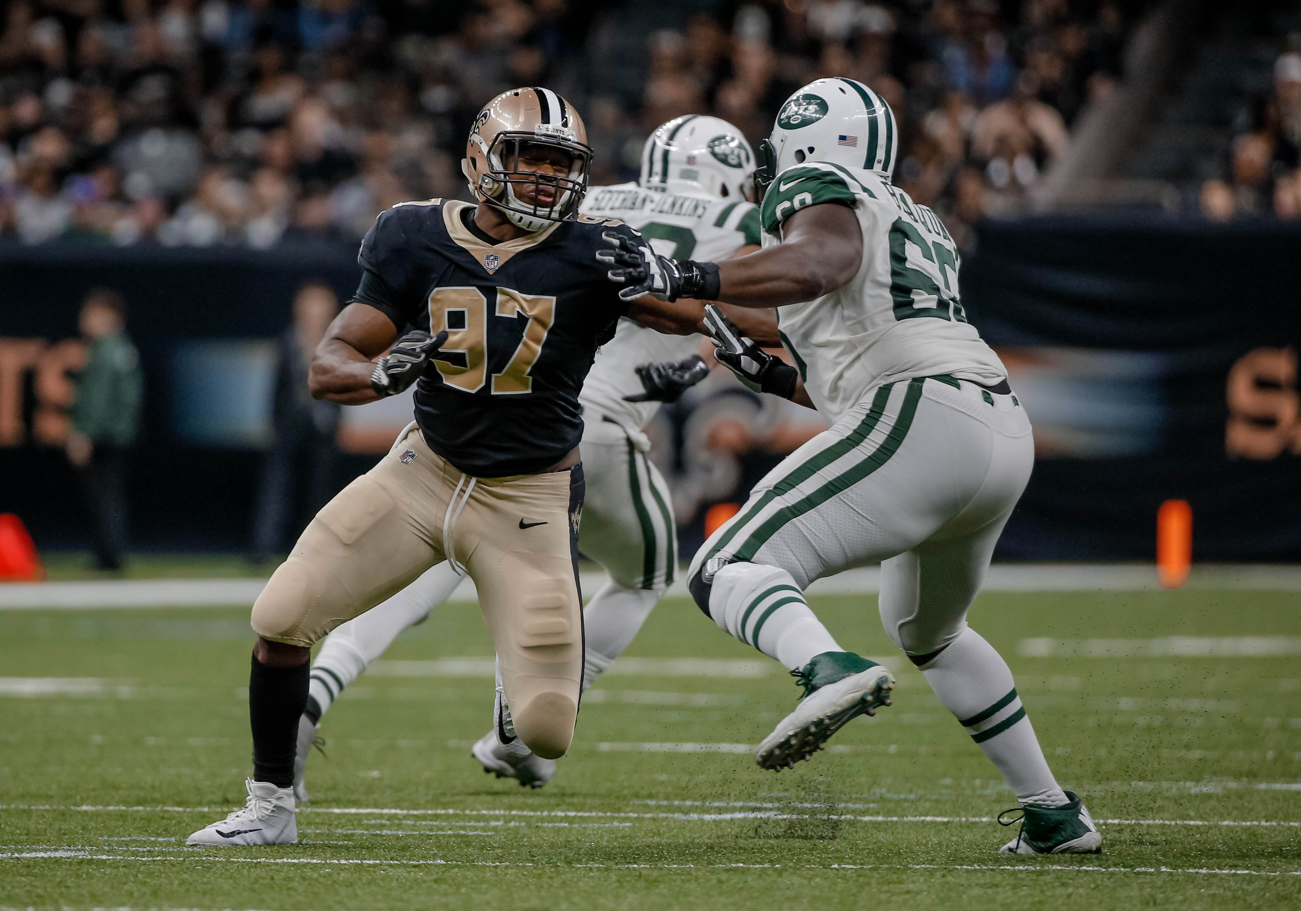 NEW ORLEANS, LA - New Orleans Saints defensive end Al-Quadin Muhammad (97) rushes against  New York Jets offensive tackle Kelvin Beachum (68) during the second  half at the Mercedes-Benz Superdome.