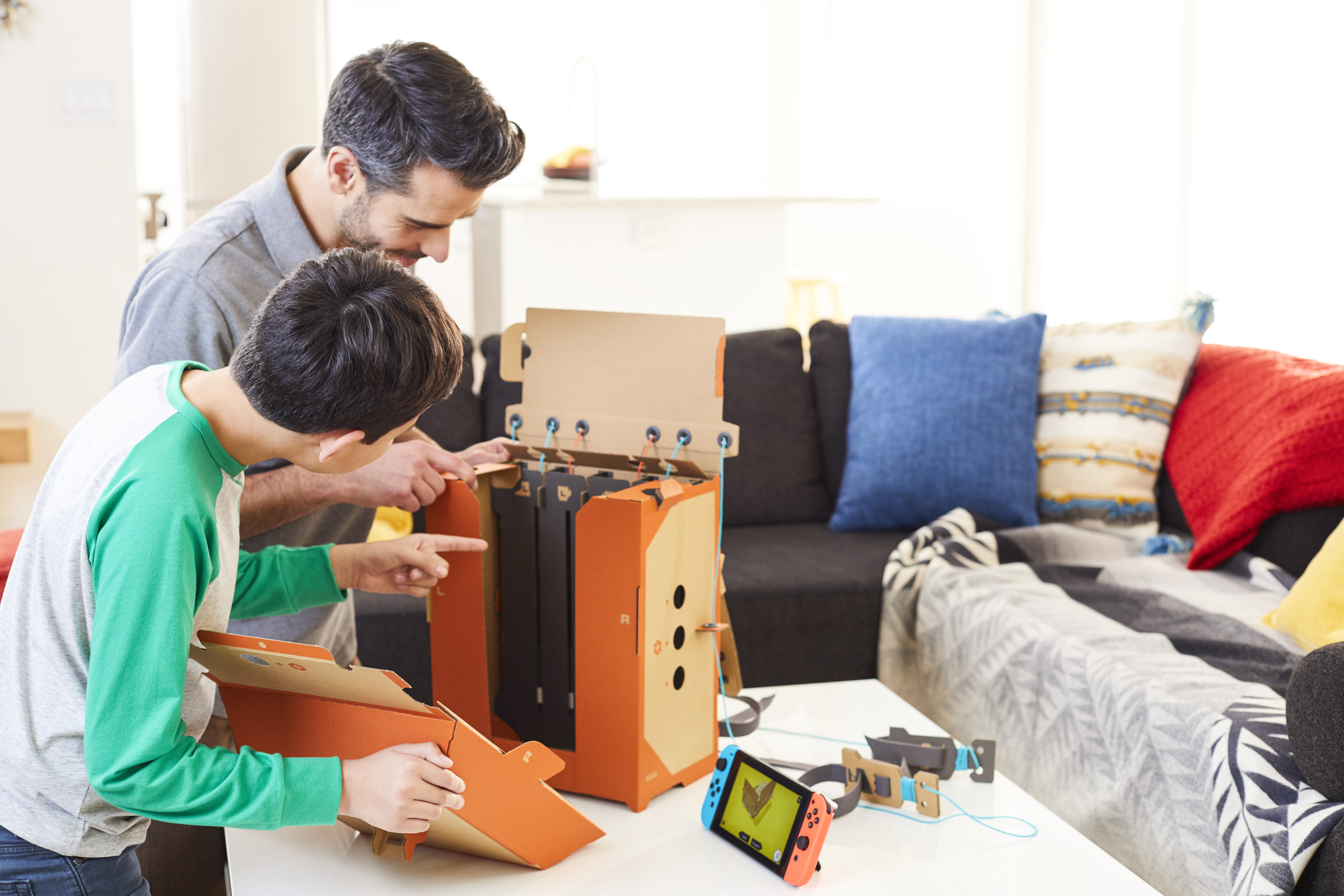 Nintendo Labo - man and boy build robot suit backpack