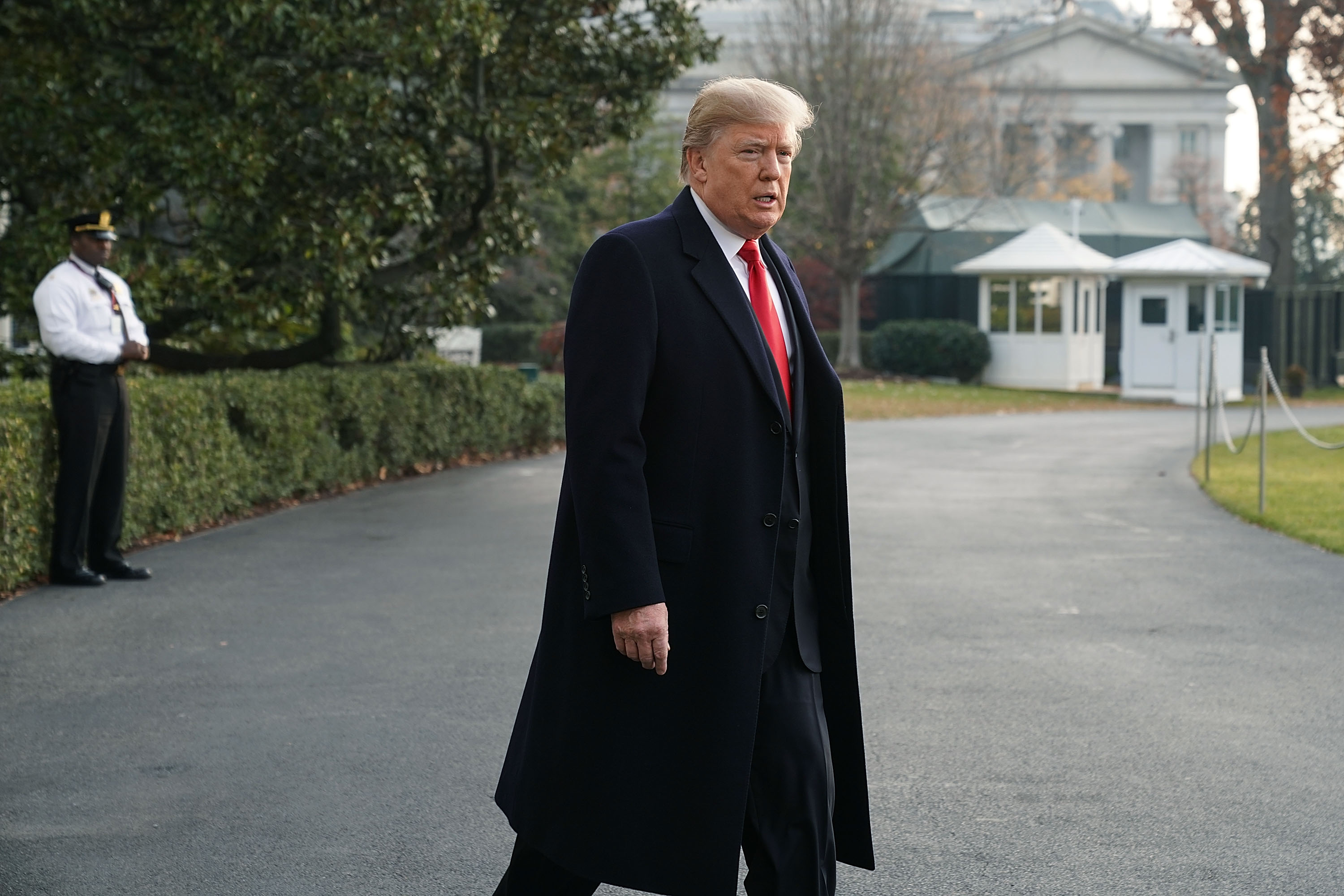 President Donald Trump approaches members of the media to speak on former national security adviser Michael Flynn’s lying to the FBI prior to his Marine One departure from the South Lawn of the White House December 4, 2017 in Washington, DC.&nbsp;