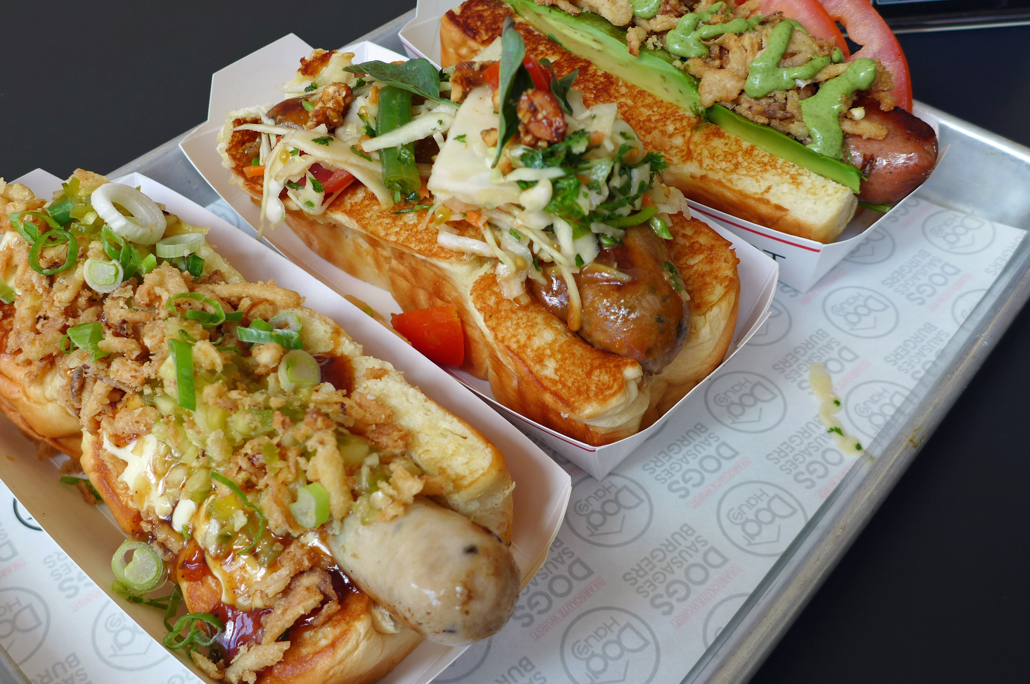 A selection of Dog Haus’ $9 frankfurters