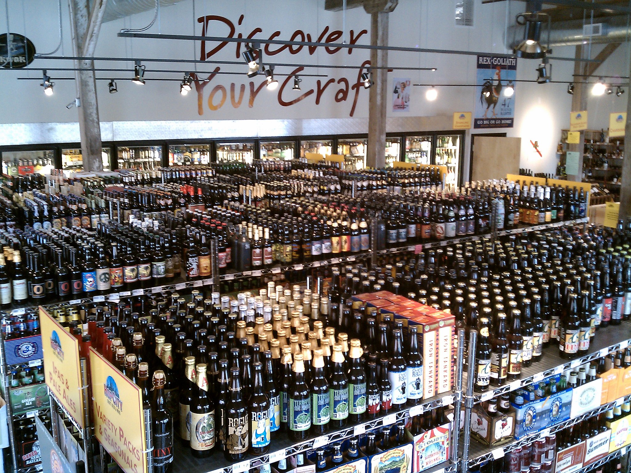 An above shot of the aisles filled with bottles of beer and wine inside the krog street market location of Hop City Craft Beer and Wine in Atlanta, GA