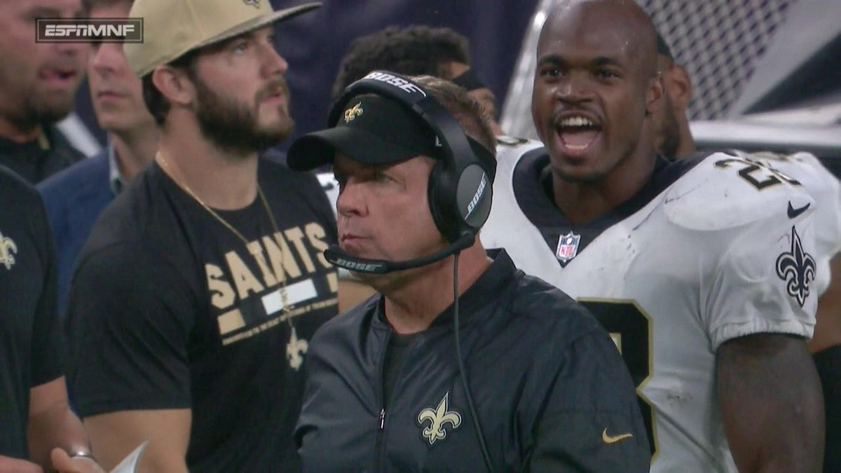 MINNEAPOLIS, MN - The ESPN Monday Night Football sideline camera catches New Orleans Saints running back Adrian Peterson (28) shouting at Saints head coach Sean Payton (center) during the 2017 season opener against the Minnesota Vikings.
